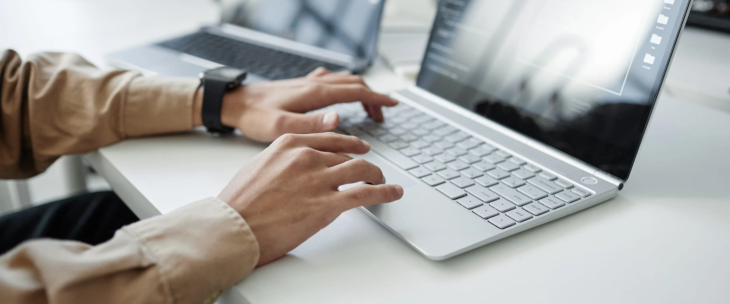 Civil engineer reviewing project data on laptop