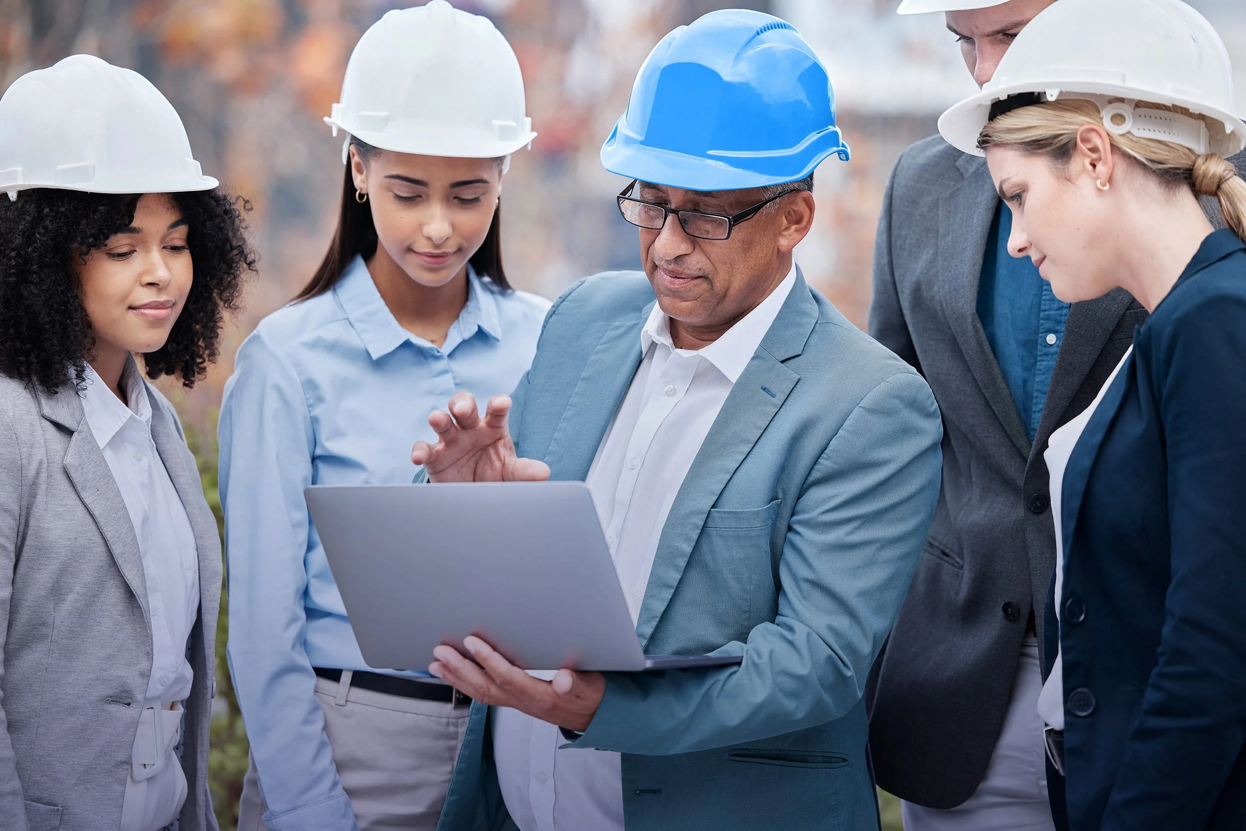 Engineers reviewing civil infrastructure plans on-site