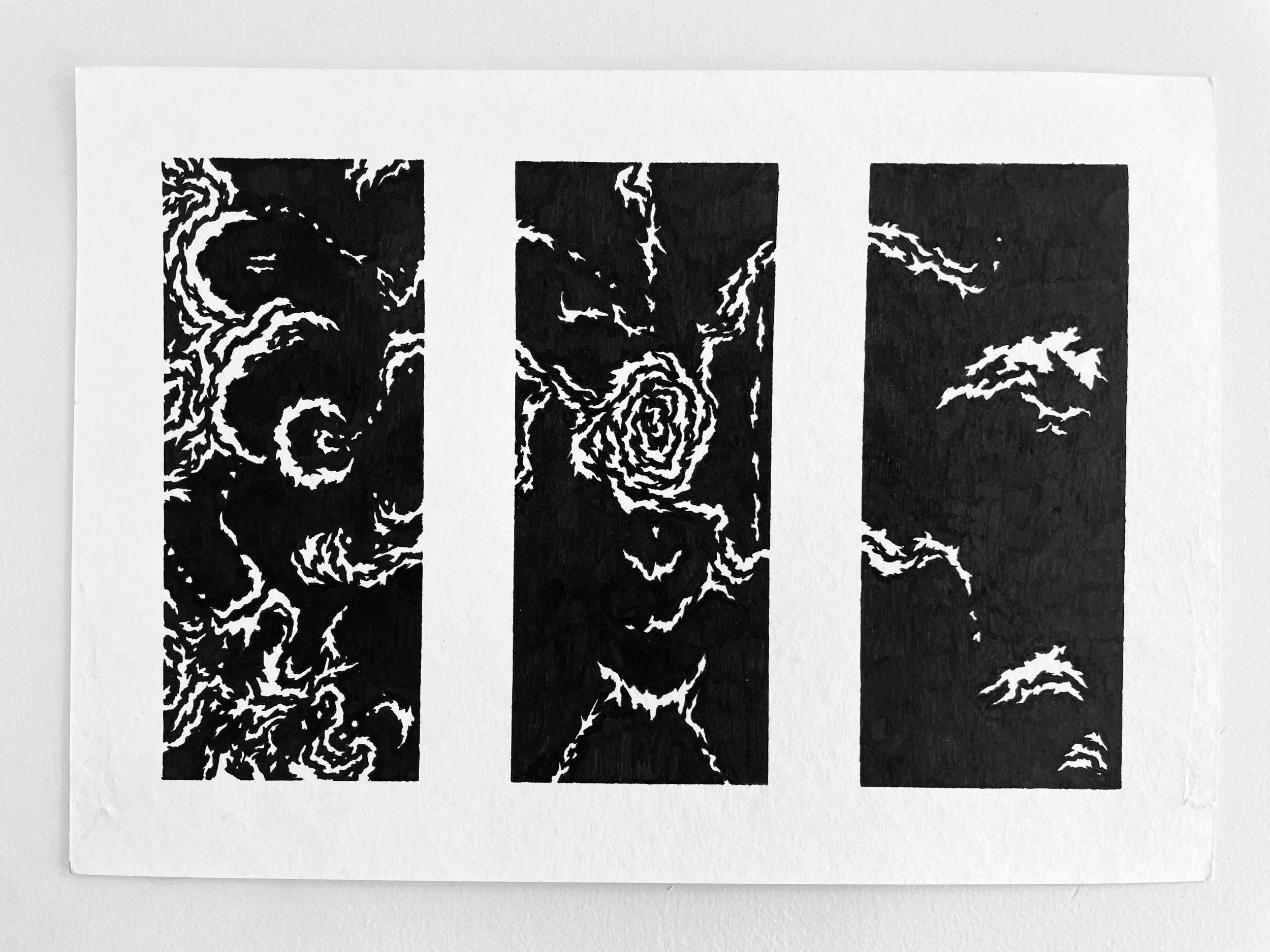 Three vertical black and white abstract panel prints resembling swirling clouds and storm formations.