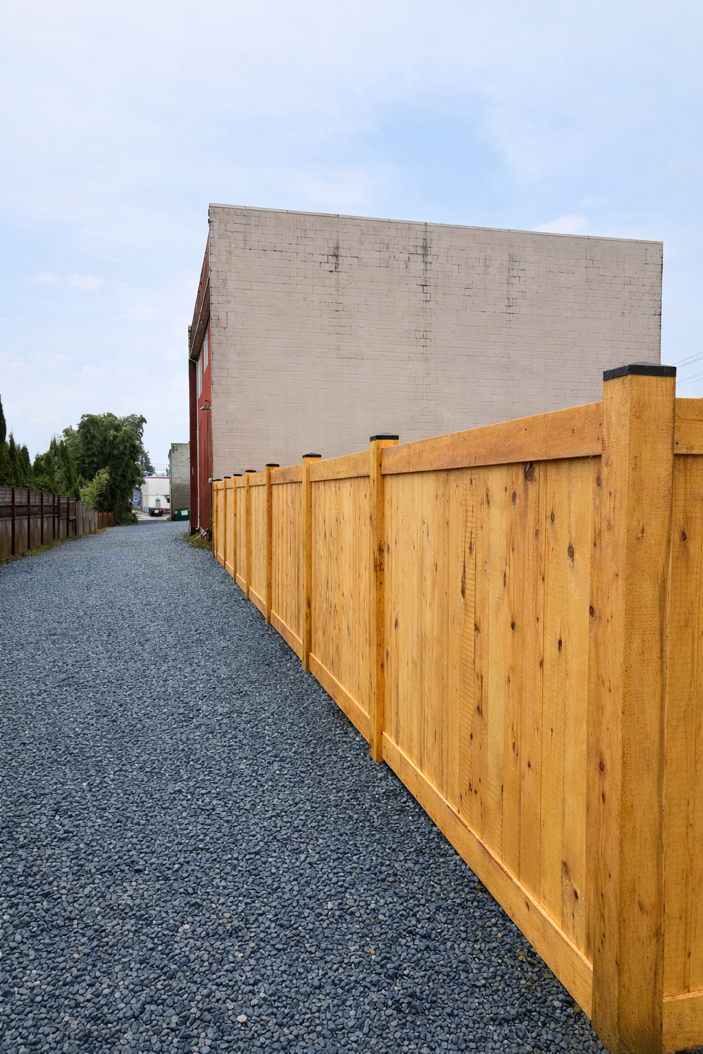 Gravel alley with cedar fence.png