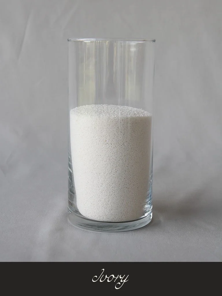 A glass of white powder labeled 'ivory'.