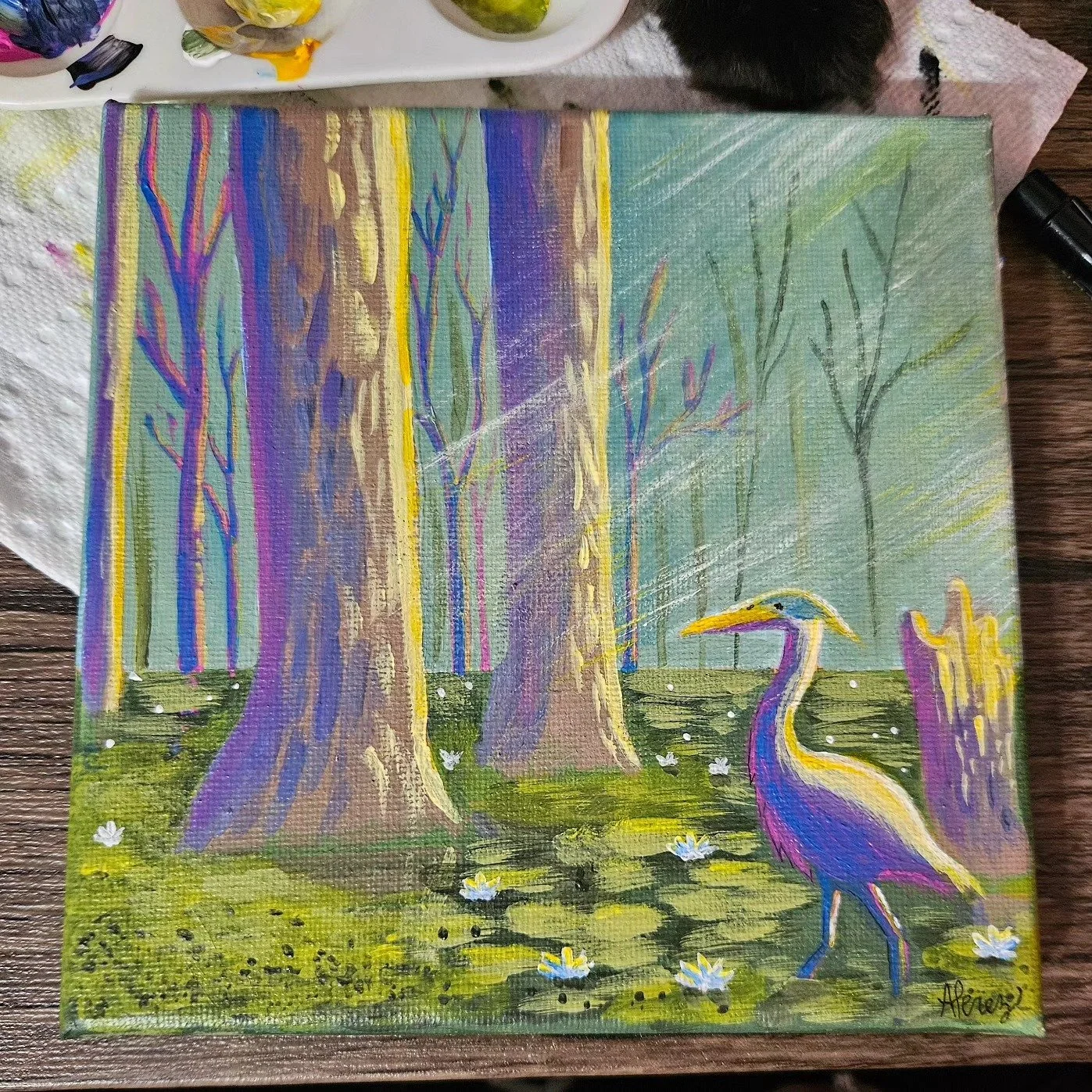 Painting of a heron standing in a pond surrounded by trees with tall, thin trunks in a colorful forest scene.
