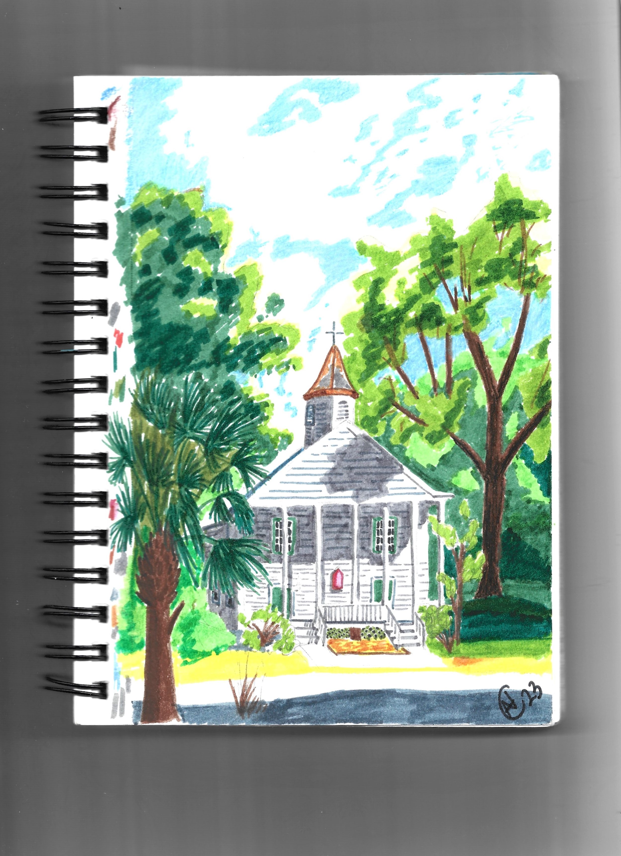 Colorful watercolor painting of a small, white wooden church with steeple, surrounded by green trees and blue sky.