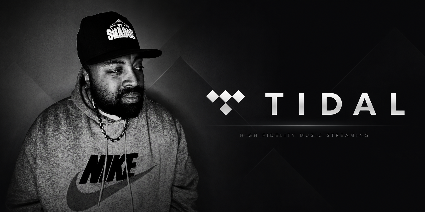 A black and white portrait of a man wearing a Nike hoodie and a cap with the word "SALUTE" on it, looking to his left, against a dark background with the word "TIDAL" and smaller text "HIGH FIDELITY MUSIC STREAMING".