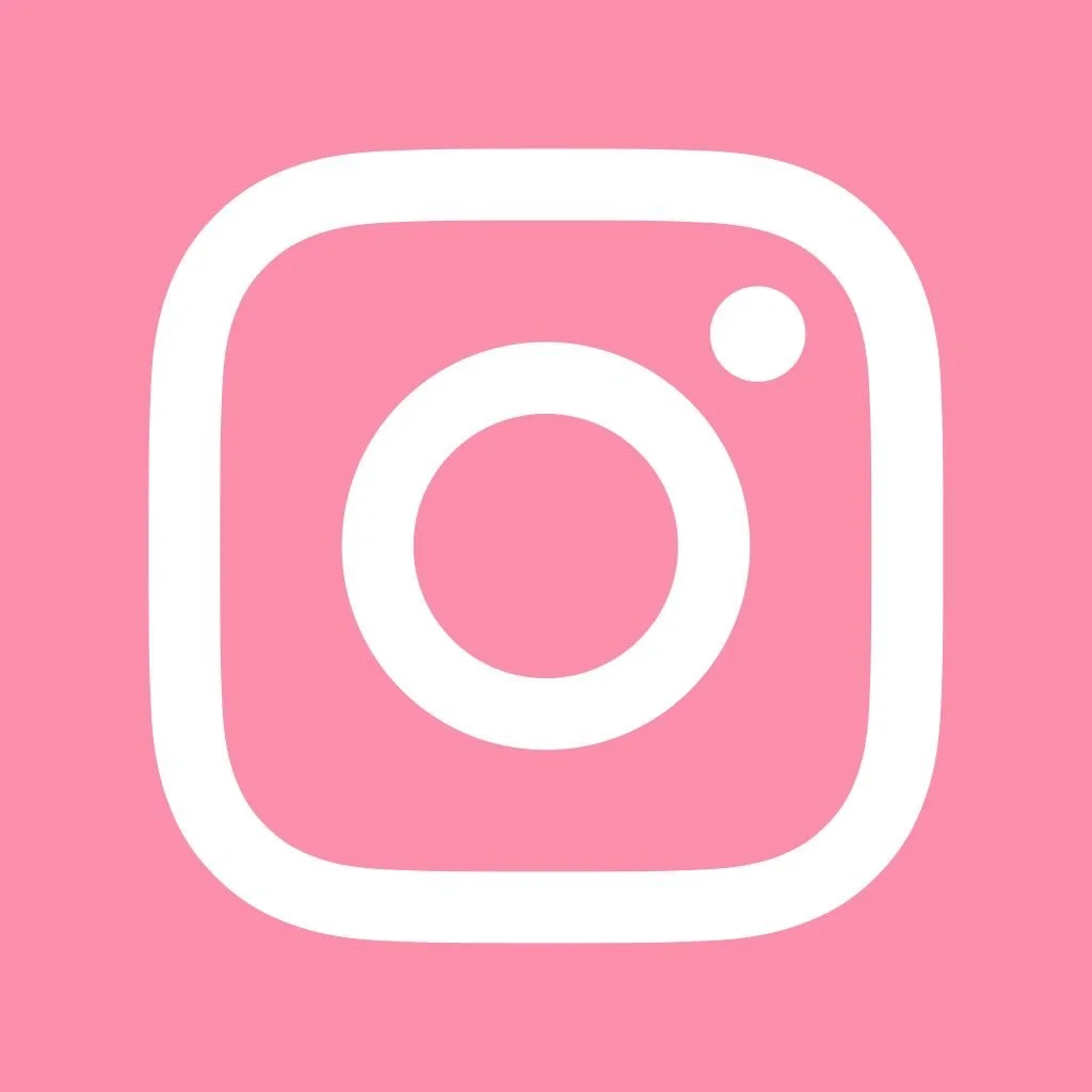 White Instagram logo on a pink background.