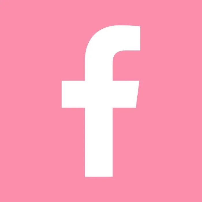 White Facebook logo on a pink background
