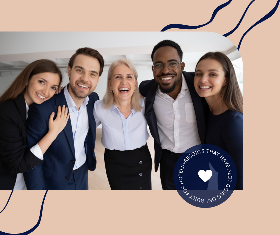 Group of five diverse smiling people standing close together indoors.