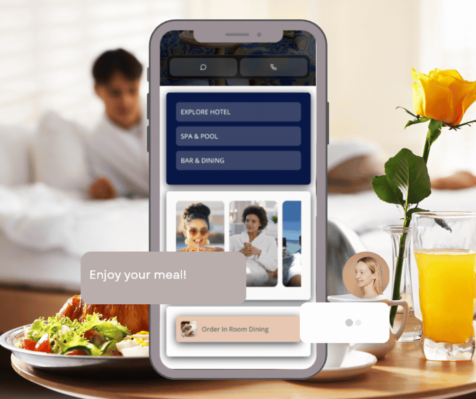 Smartphone displaying hotel booking options and images of people, placed on a dining table with a plate of salad, a glass of orange juice, a yellow rose in a vase, and a woman lying in bed in the background