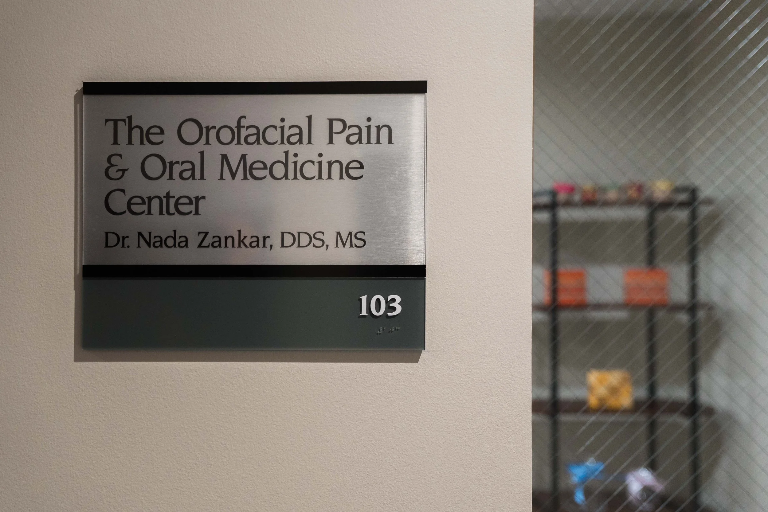 Clinic  sign for 'The Orofacial Pain & Oral Medicine Center' with the name Dr. Nada Zankar, DDS, MS,