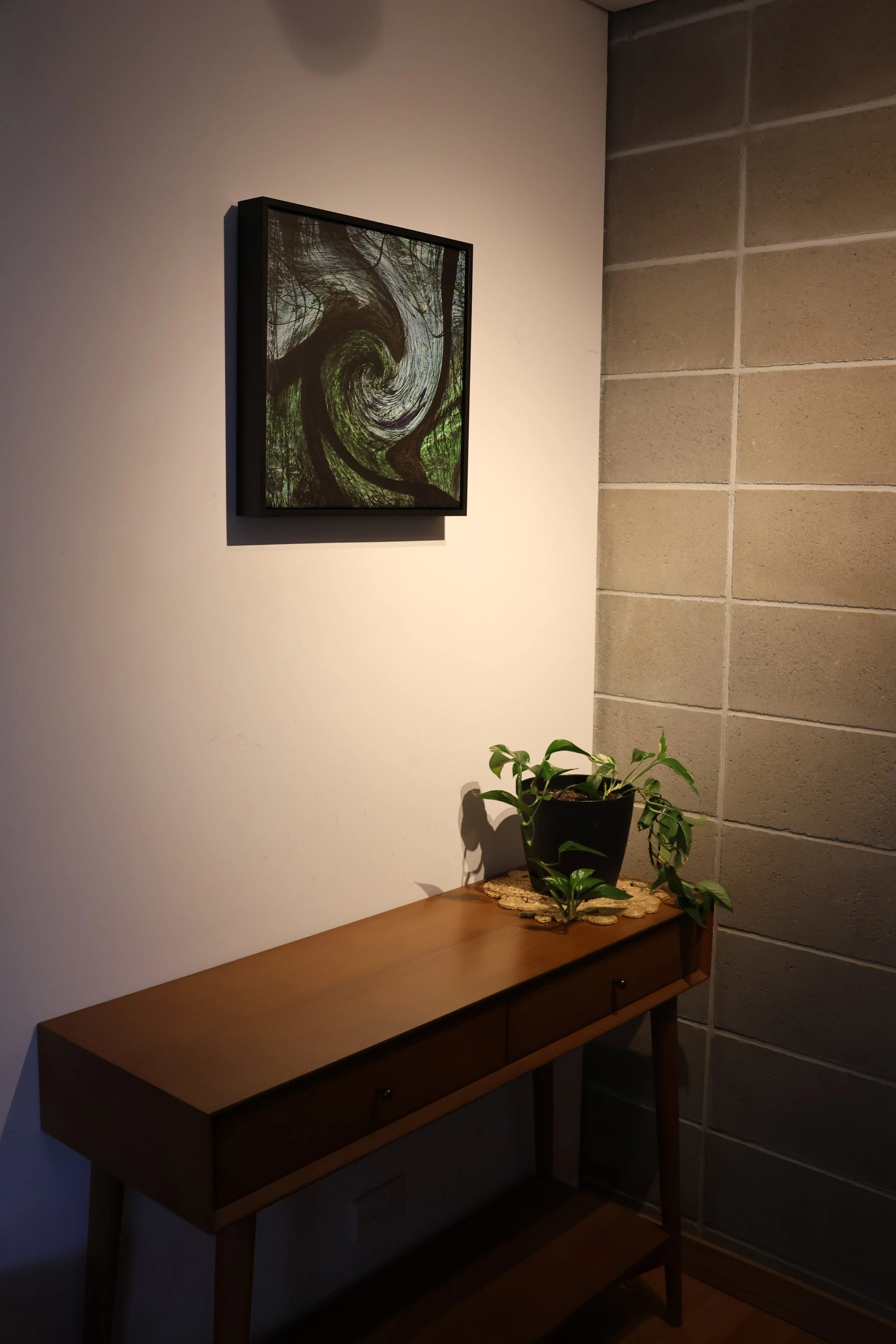 Abstract artwork "UNDERTOW" in home setting