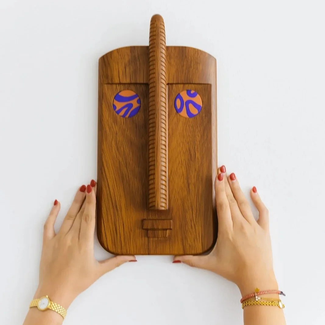 Thalos hand-carved decorative wall mask in natural Kambala wood with expressive eye detail