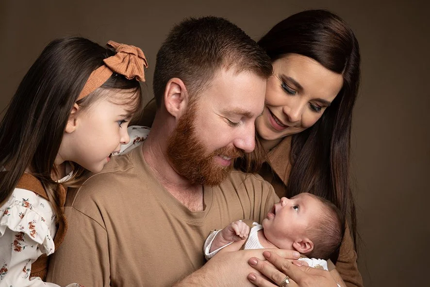 famille avec bébé photographié par un photographe à Treillieres