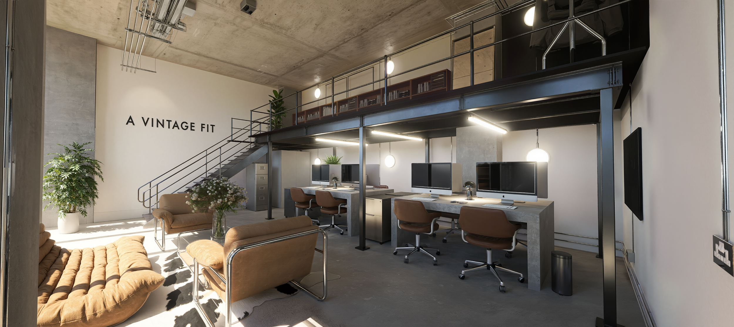Modern office space with a sitting area, a double staircase, and a row of workstations with desktop computers, brown chairs, and hanging round lights. The wall features the text 'A VINTAGE FIT'; there are potted plants and bookshelves on the upper level.
