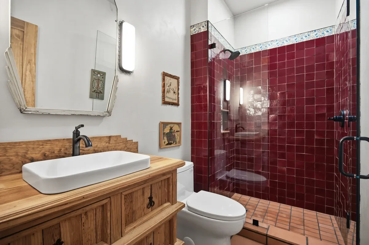 hey-house-room-2-bathroom-red-tile-shower-wooden-vanity-1200w.webp