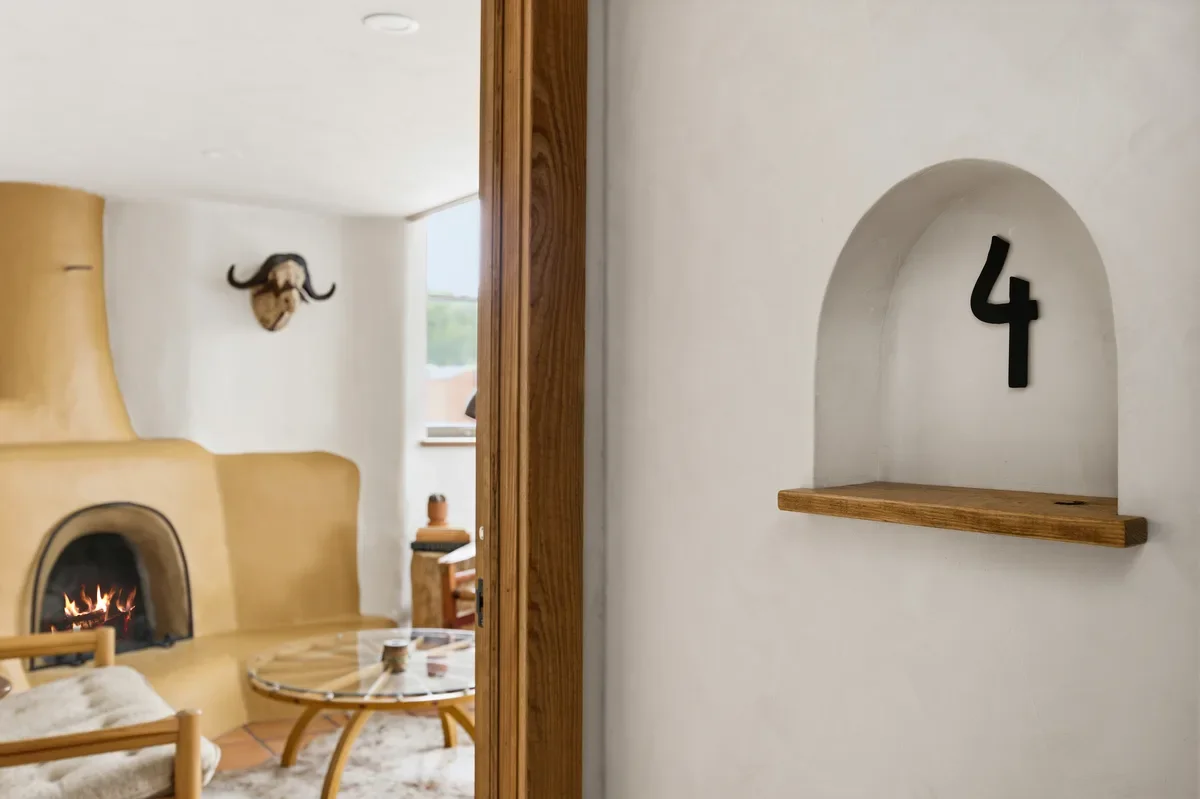 hey-house-room-4-entrance-number-sign-fireplace-view-1200w.webp
