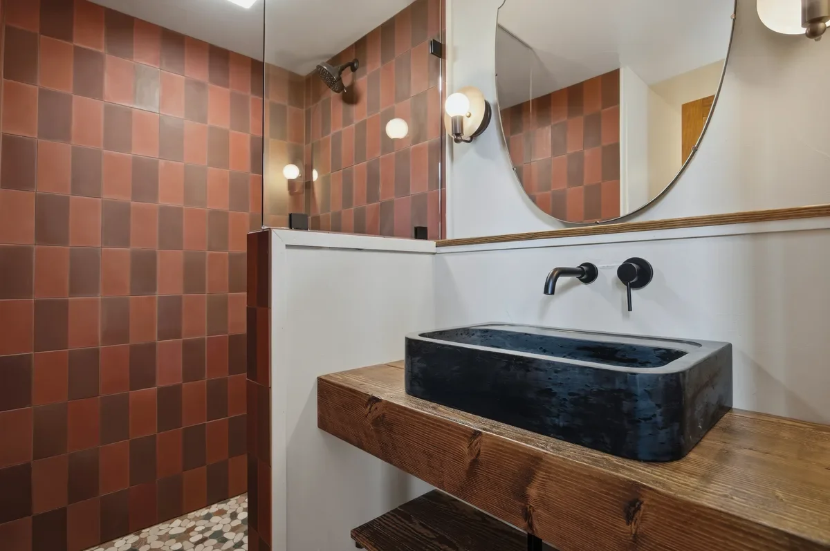 hey-house-room-4-bathroom-stone-sink-reclaimed-wood-shelf-1200w.webp