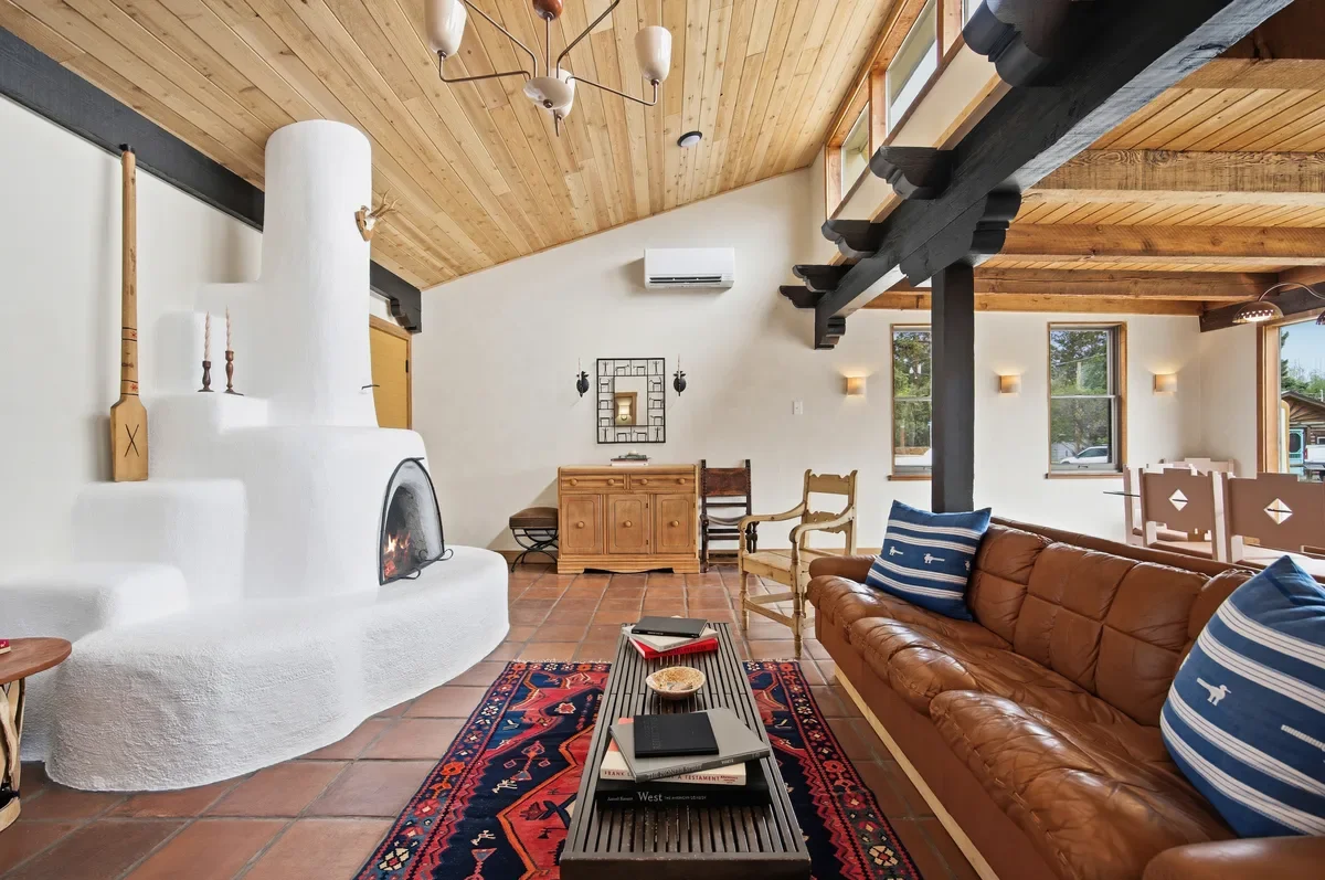 hey-house-living-dining-room-kiva-fireplace-open-plan-1200w.webp