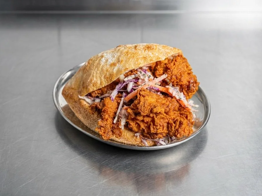 The F*ck it - is our way of doing fried chicken.
Double fried chicken thighs, pomegranate molasses and mint slaw, habanero molasses sauce.

Just 3 ingredients in the sarnie. No faff. No unneeded additions. Because a great fried chicken doesnt need to