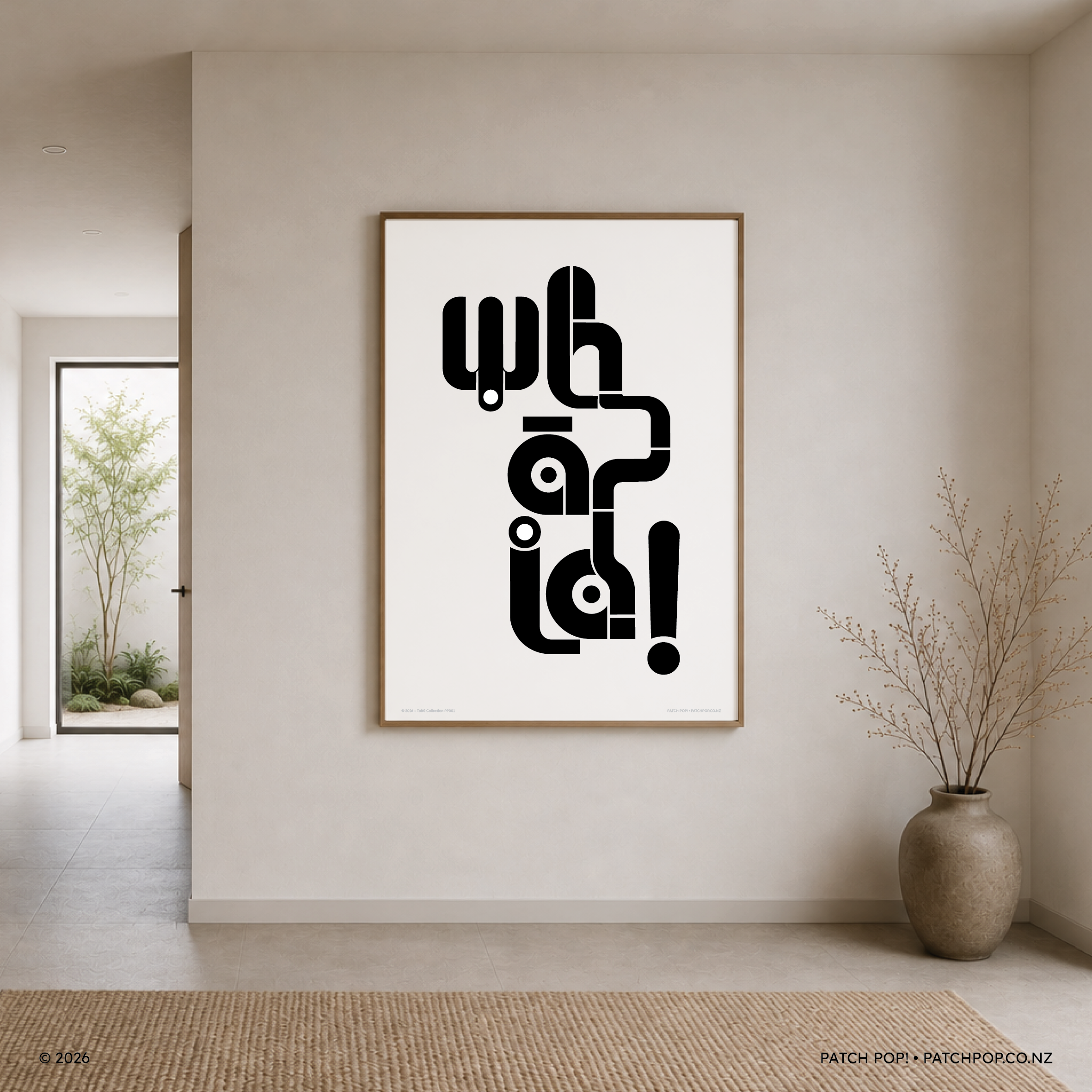 Minimalist interior with a large framed black and white abstract artwork on a white wall, a potted plant, and a woven rug on a tiled floor.