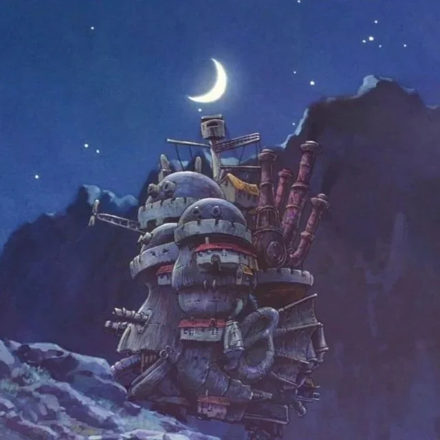 A film still from the animated film by Studio Ghibli Howls Moving Castle (2004) adapted from book of the same name. A chaotic castle is walking on rough terrain in the moon light.