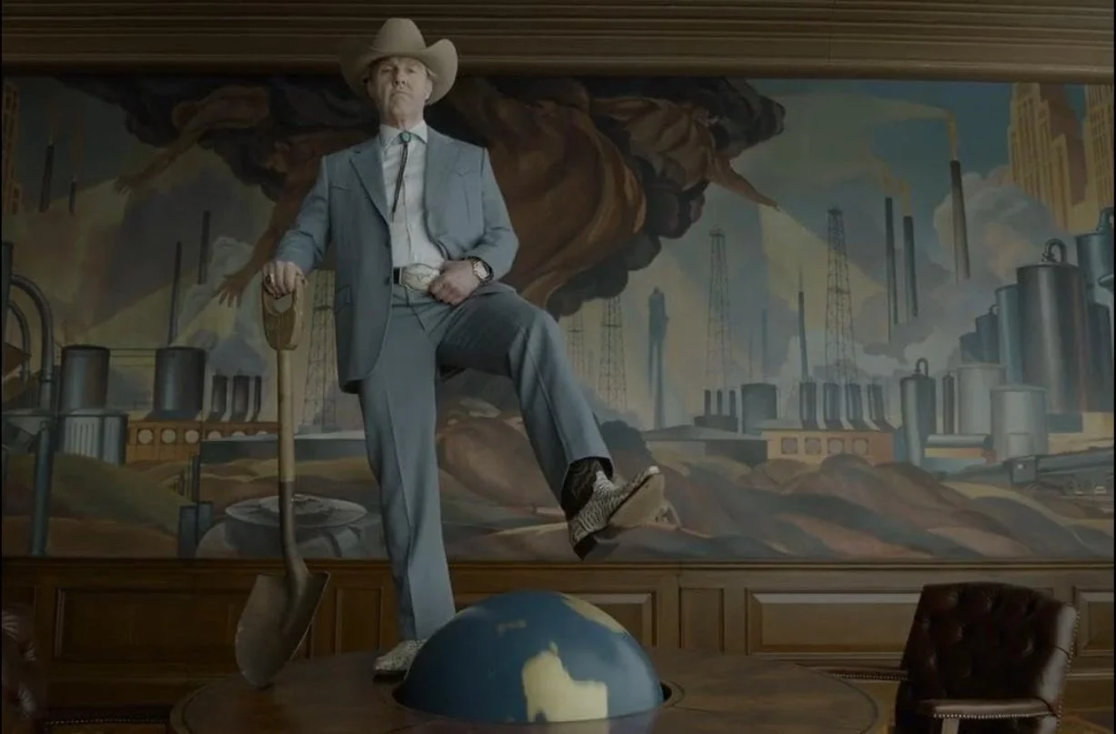 An image of a man in a suit and cowboy hat standing on a table with one foot on a globe, in front of an industrial mural background with factories and smoke. Digger (2026) directed by Alejandro G. Iñárritu, starring Tom Cruise.