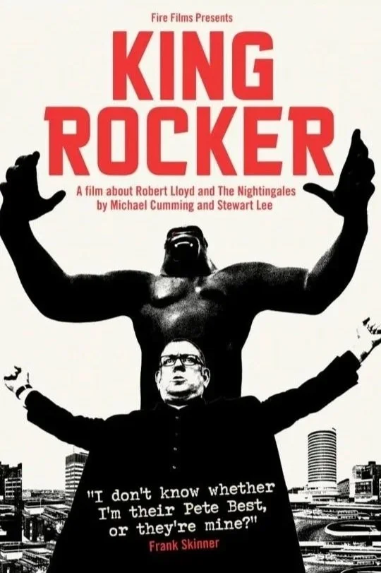 Poster for the film 'King Rocker' featuring a large gorilla-like figure with muscular arms and a small man in a suit below, with city buildings in the background. The text reads 'Fire Films Presents King Rocker, a film about Robert Lloyd and The Nightingales by Michael Cumming and Stewart Lee. A quote says, "I don't know whether I'm their Pete Best, or they're mine?" attributed to Frank Skinner.