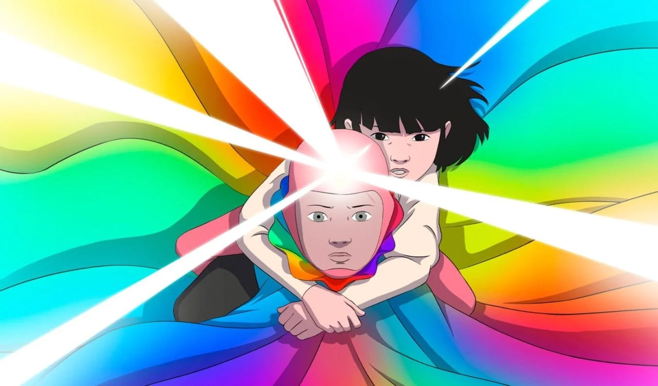 Two young children, one with black hair and one wearing a rainbow cloak are holding each other against a vibrant rainbow-colored background. Bright white light beams radiate from the boys head, creating a dynamic and intense scene. Arco 2025