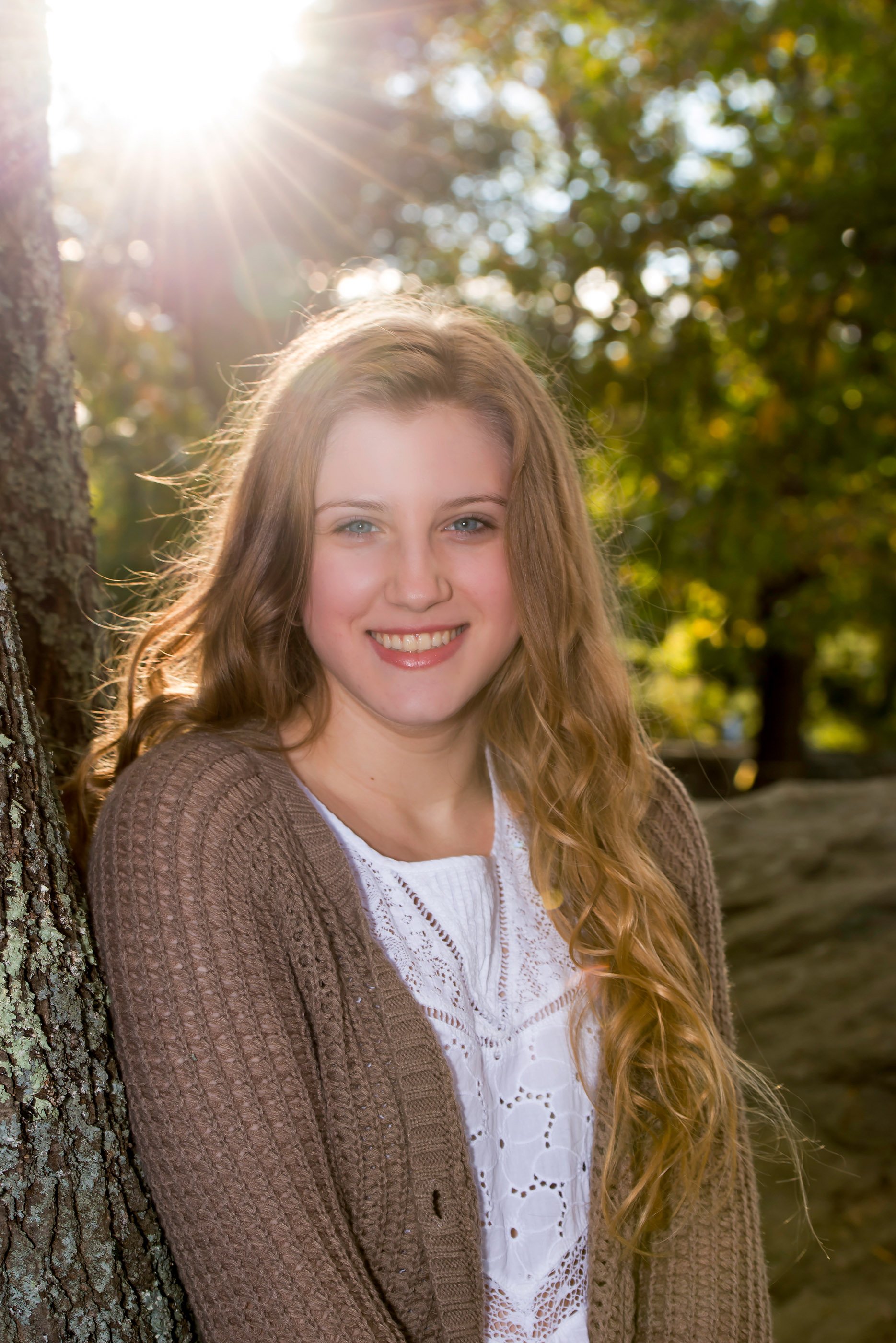 High school senior portrait, wooded scene