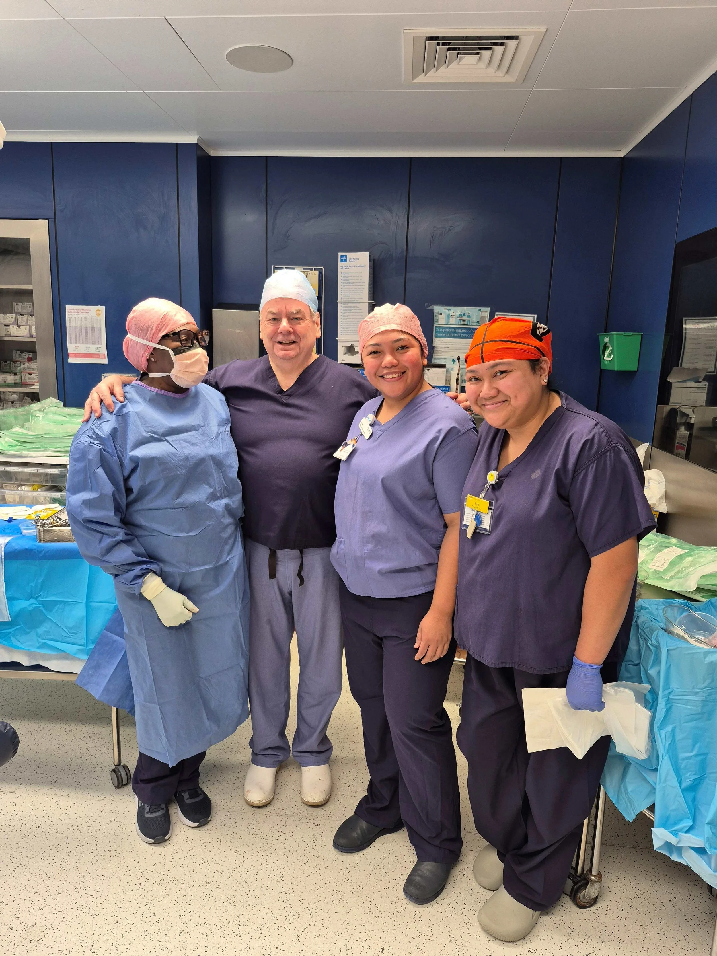 Mr Nicholas Morris FRCOG with his gynaecological surgical team in the operating theatre
