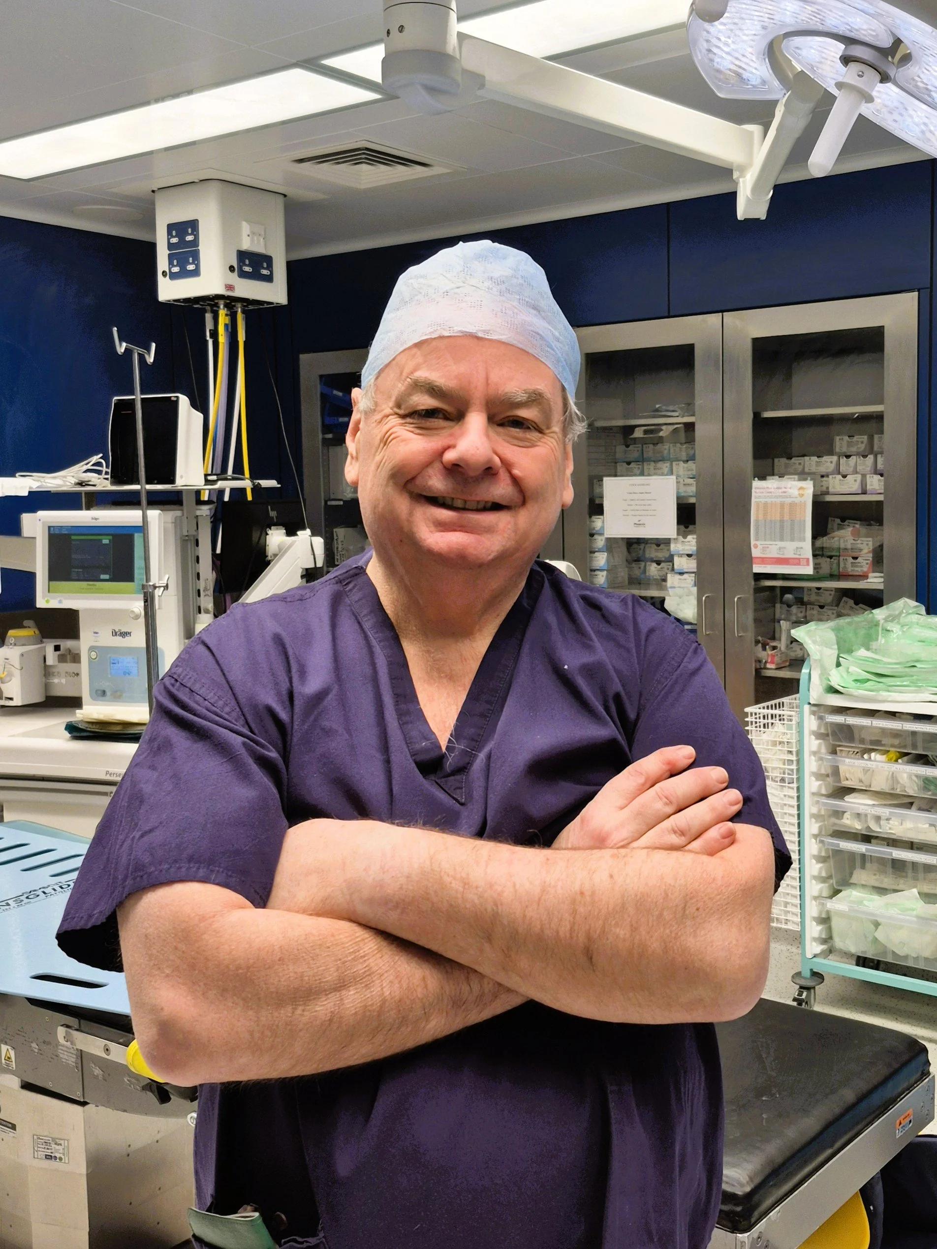 Mr Nicholas Morris MBBS FRCOG, Consultant Gynaecologist and Obstetrician, in surgical scrubs in the operating theatre