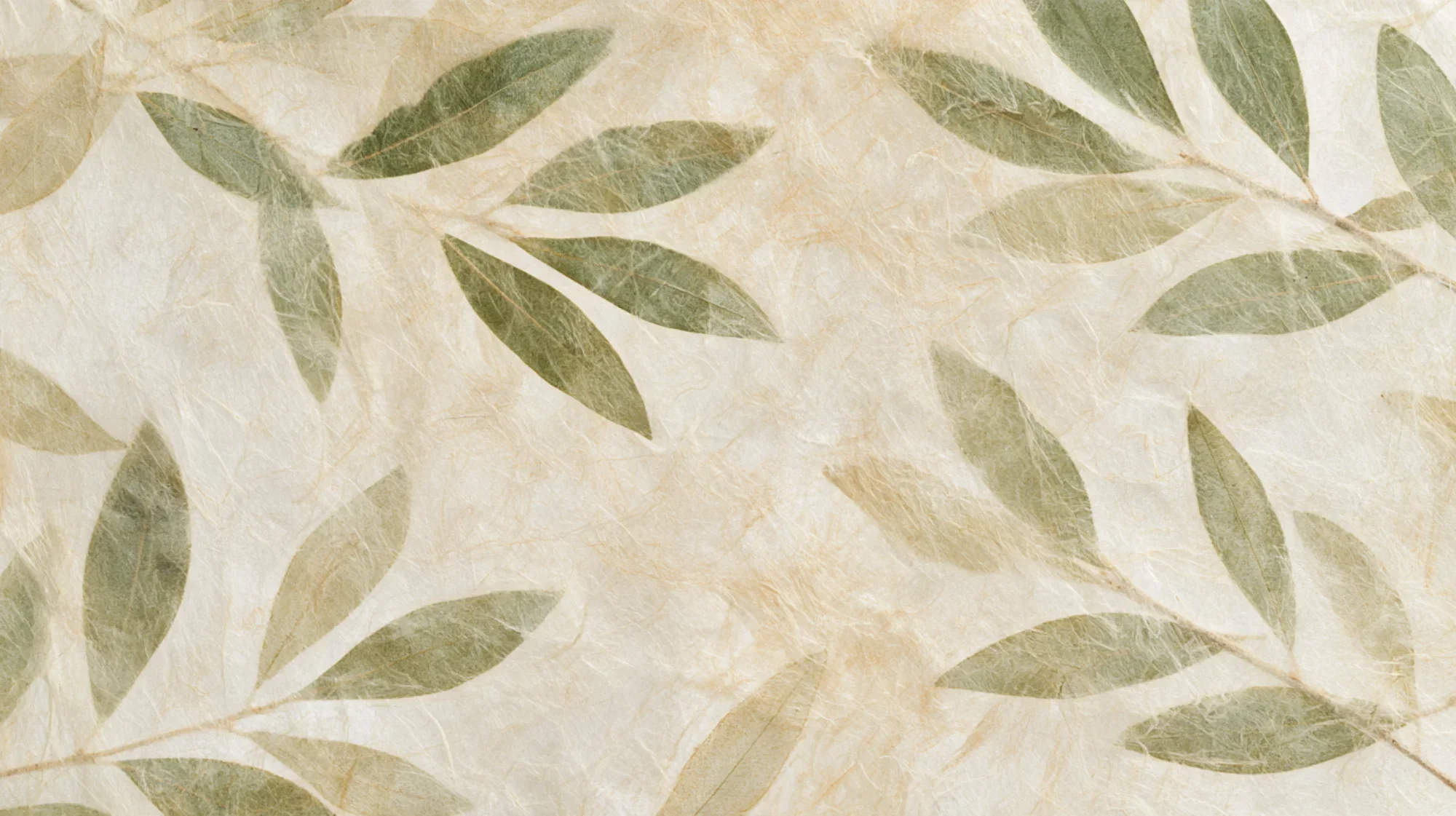 Green leaves pattern on a textured beige background.