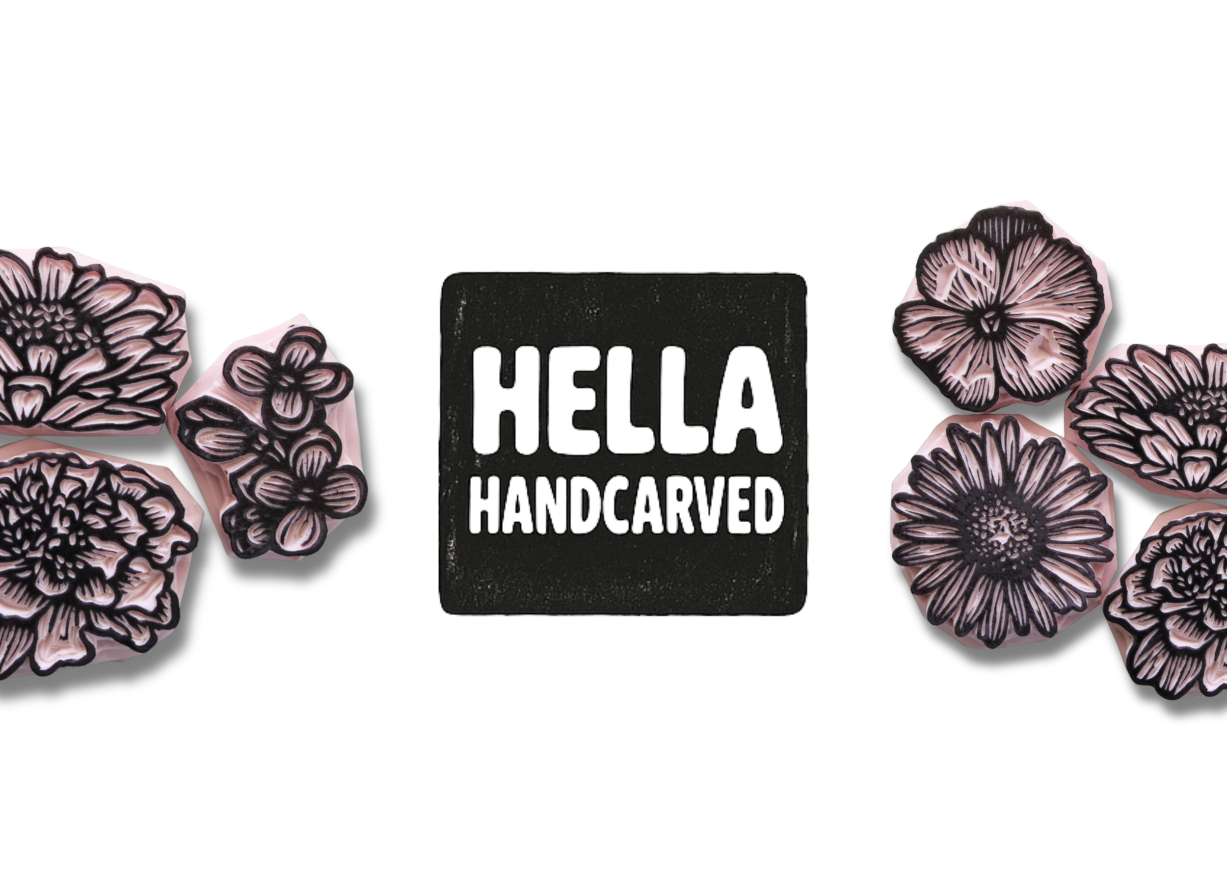 A sign that says 'HELLO HANDCARVED' surrounded by pink and black carved flowers.
