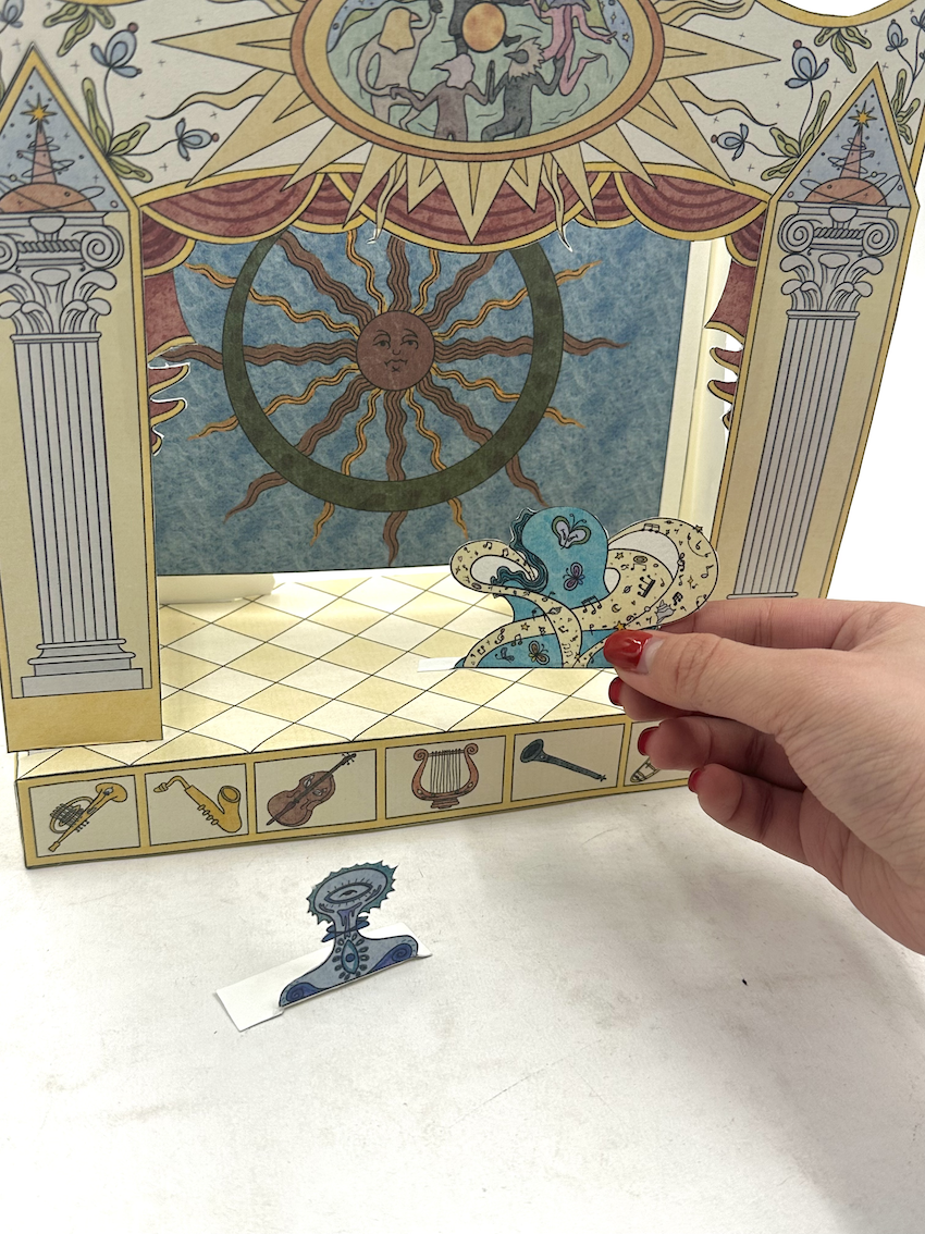 A handcrafted paper theatre translating classical performance - opera - into a miniature stage environment.