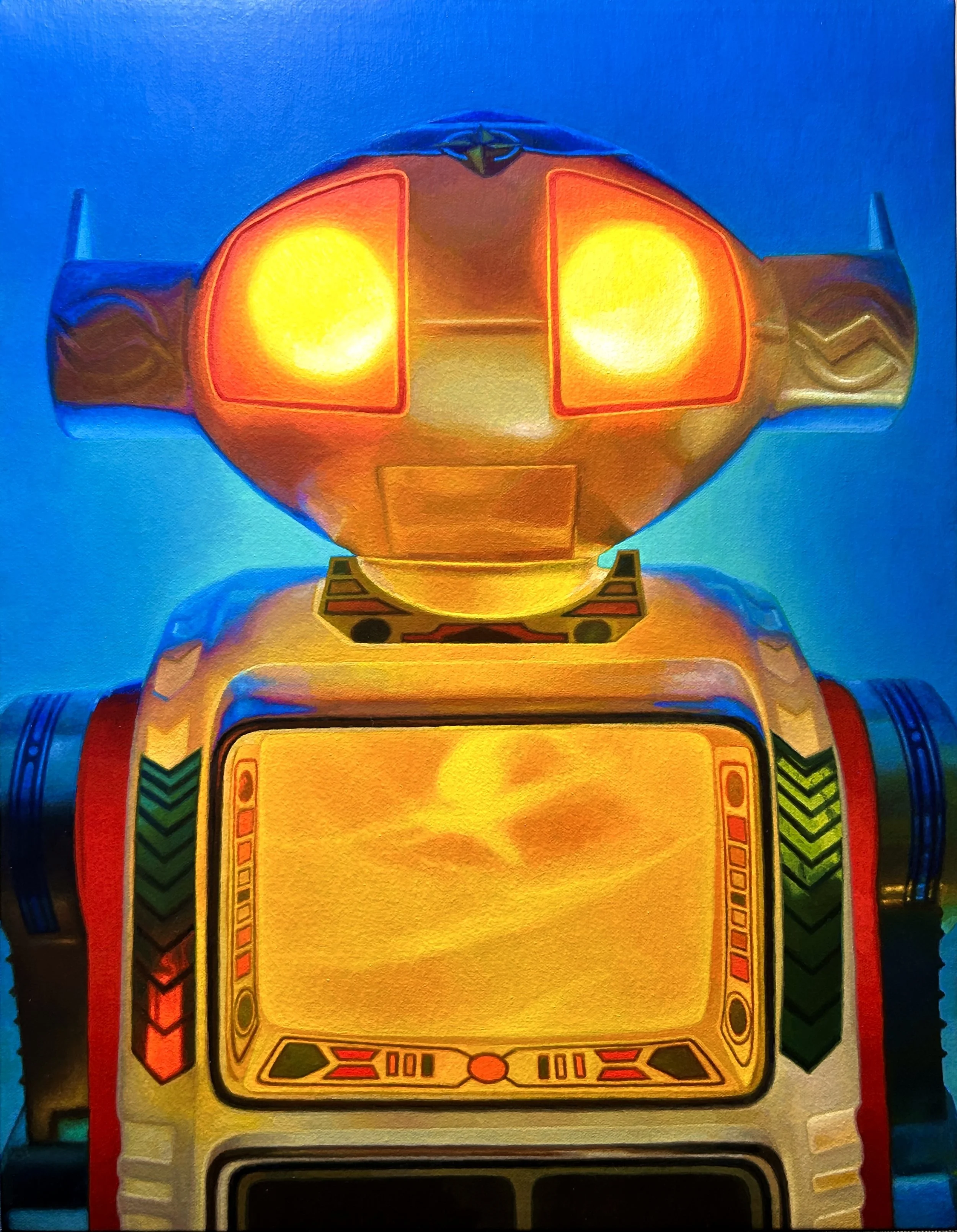 A close-up of a vintage toy space helmet with illuminated yellow lights on the front, surrounded by red, blue, and yellow details, against a plain background.