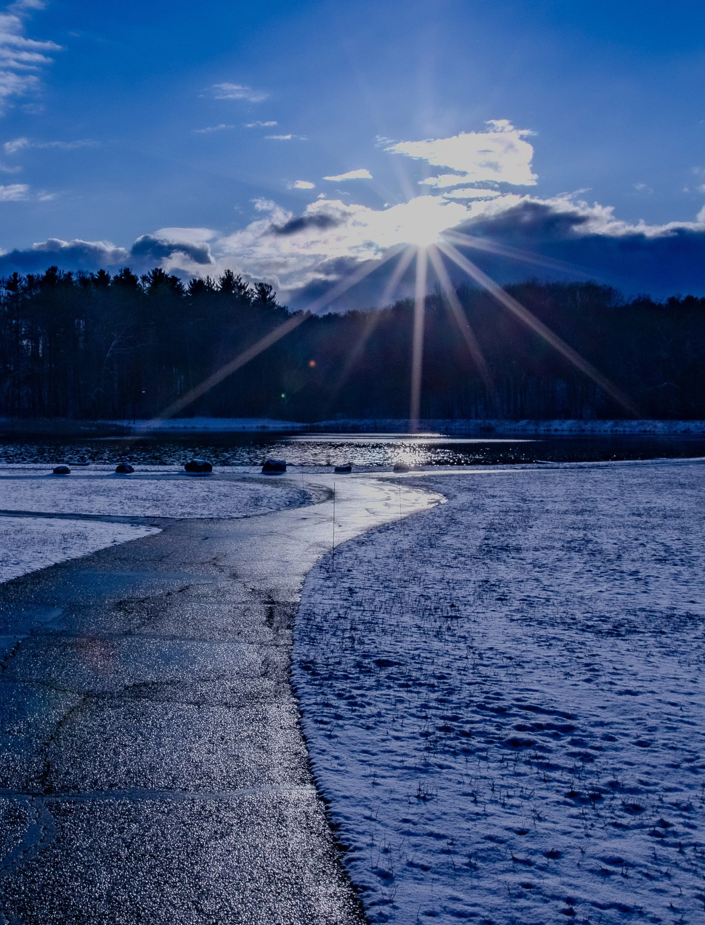 Winter sunlight breaks across the landscape, bringing warmth to a quiet season.