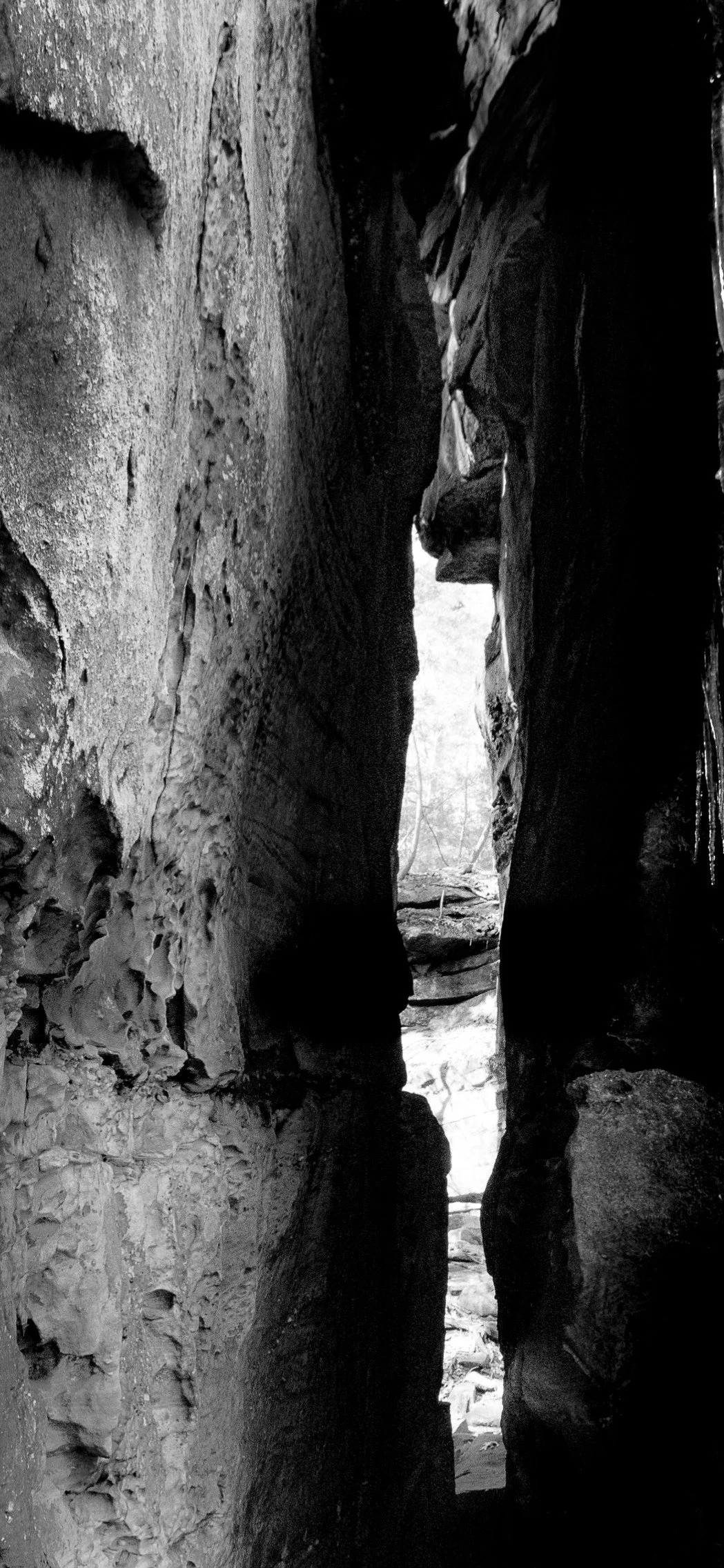 Light finds its way through ancient sandstone formations.
