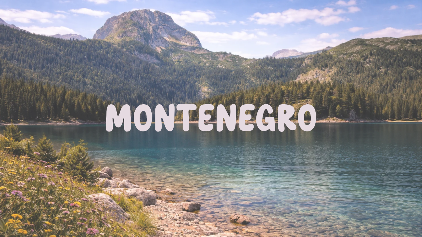Scenic view of a mountain lake in Montenegro, with clear water, a forested shoreline, and mountain peaks in the distance.