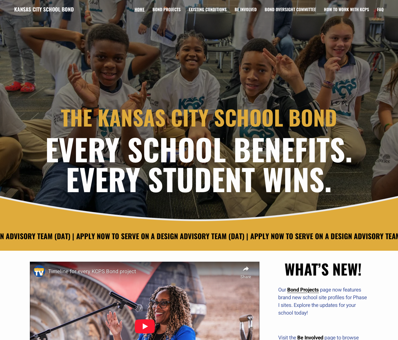 Home page for the KansasCity Public School's Bond Initiative. Smiling group of diverse elementary school students sitting on the floor, wearing KCPS shirts, during a classroom activity.