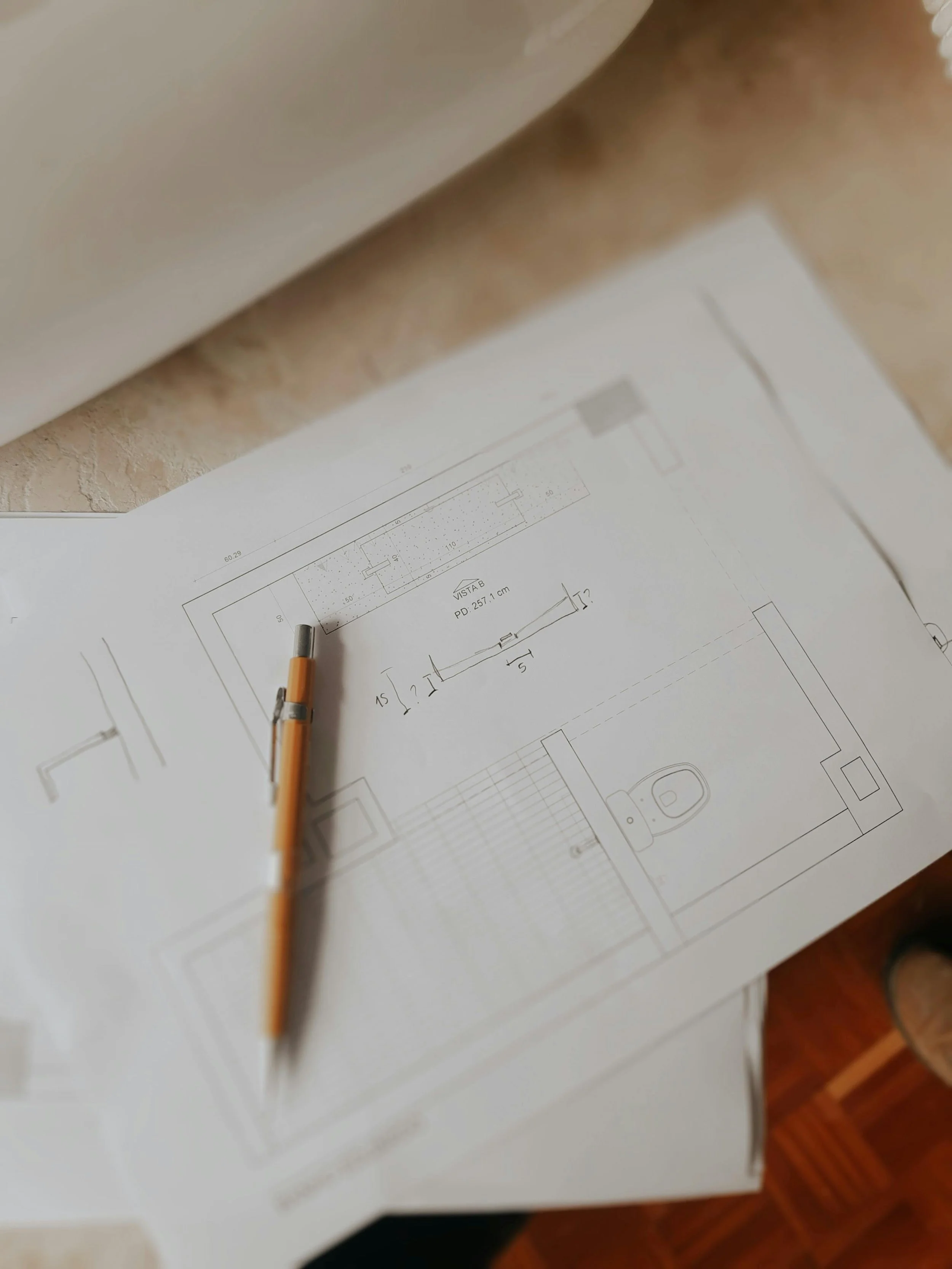 PropertyDevelopmentAdvisory - project plans with pencil on table