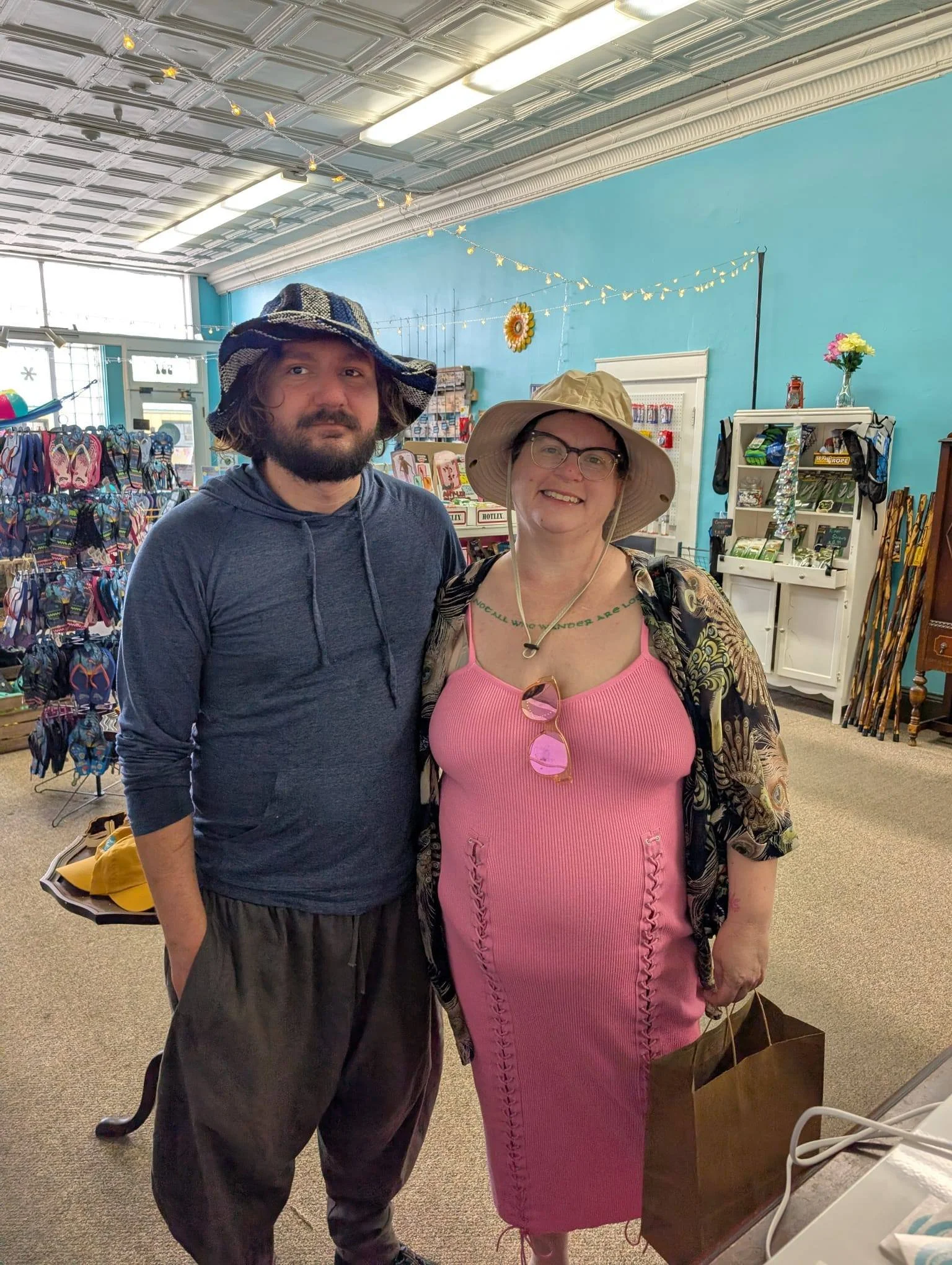 Our customers enjoying the store and picking up a couple of hats to stay cool.