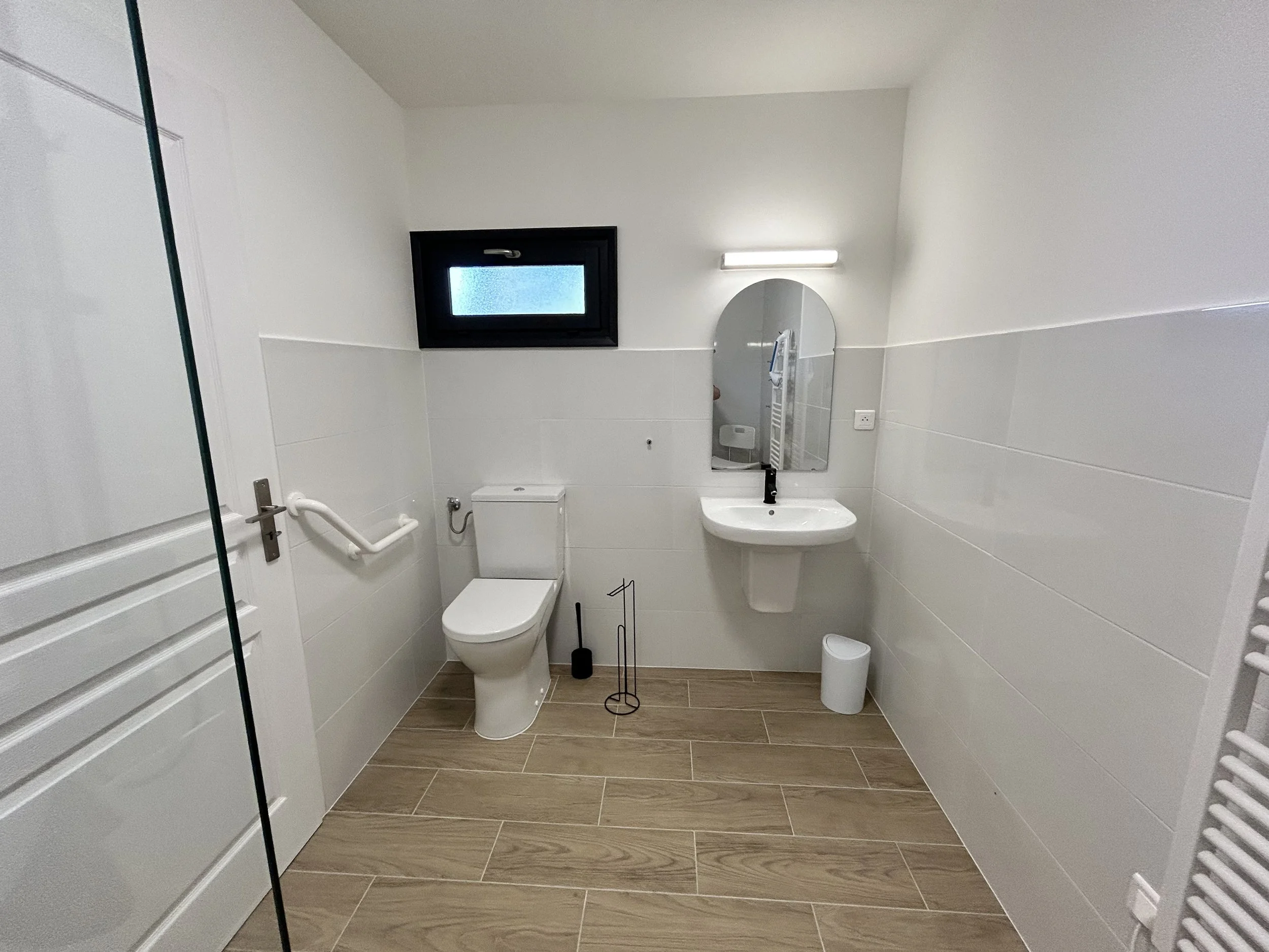 Downstairs shower room showing toilet and sink.jpeg