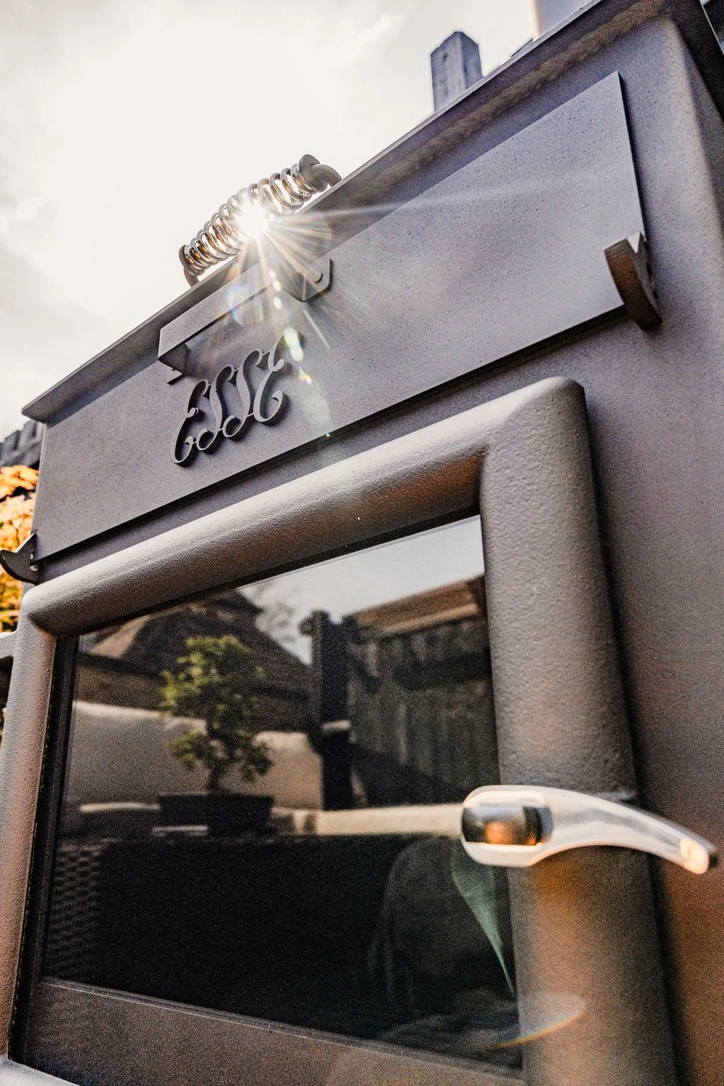 Close-up of a black outdoor stove.