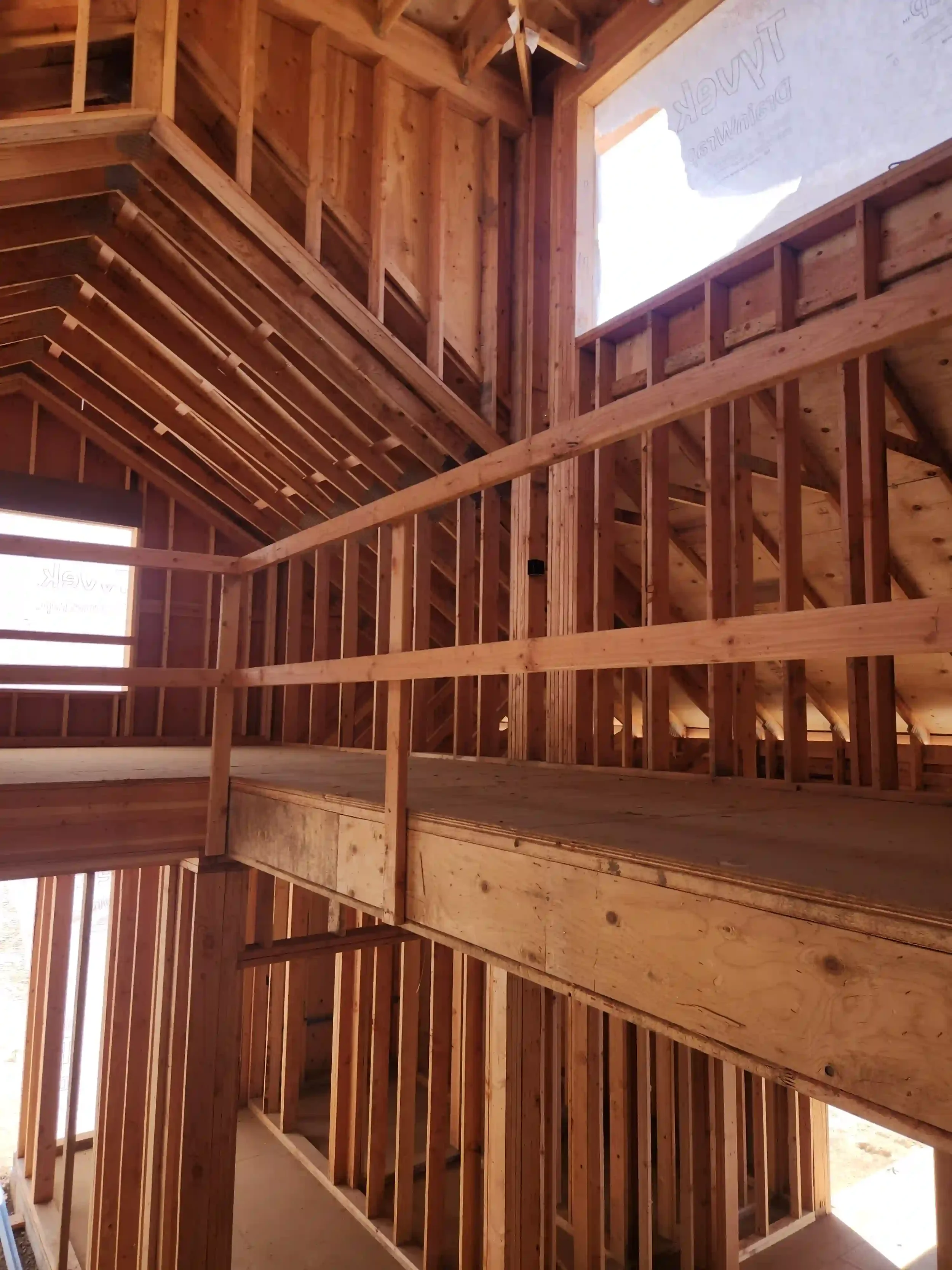 Interior wood framing for a two-story home by Jepsen Construction