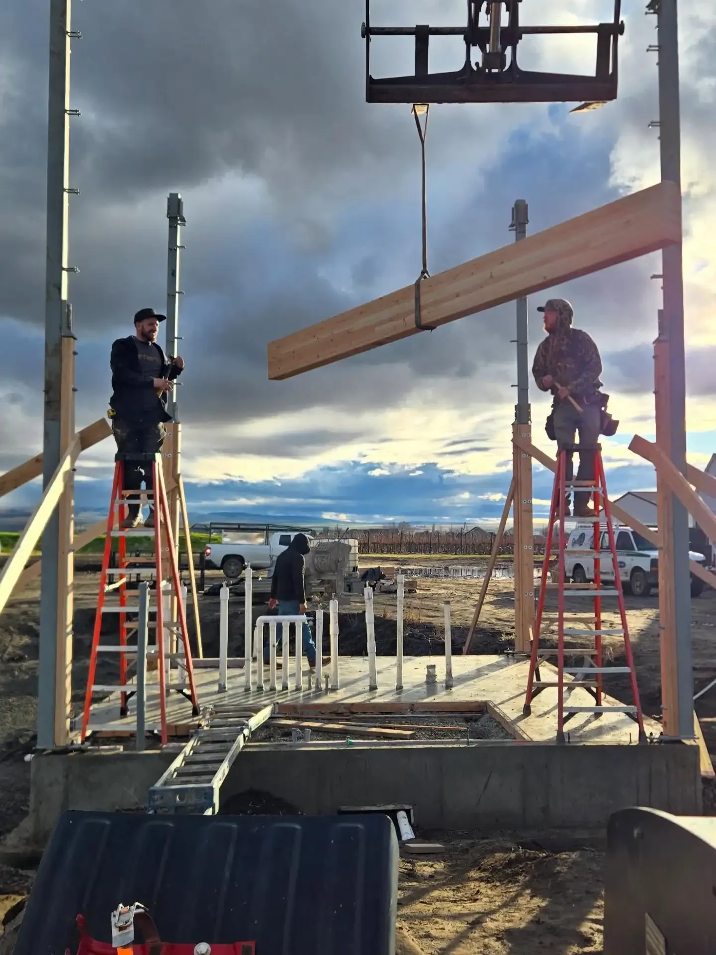 Jepsen Construction crew setting a wood beam during a new construction project