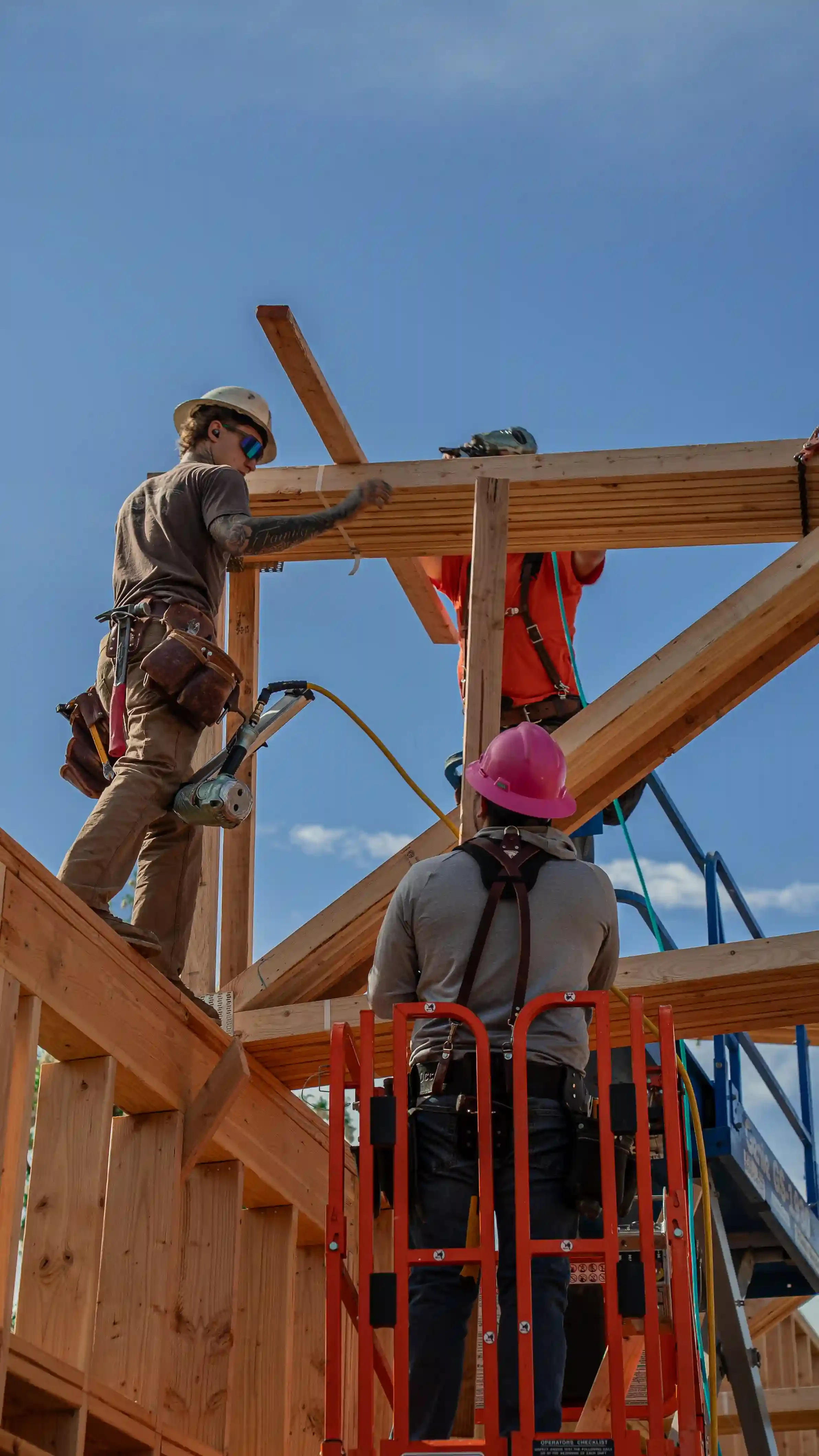 Jepsen Construction crew installing roof framing on a new building