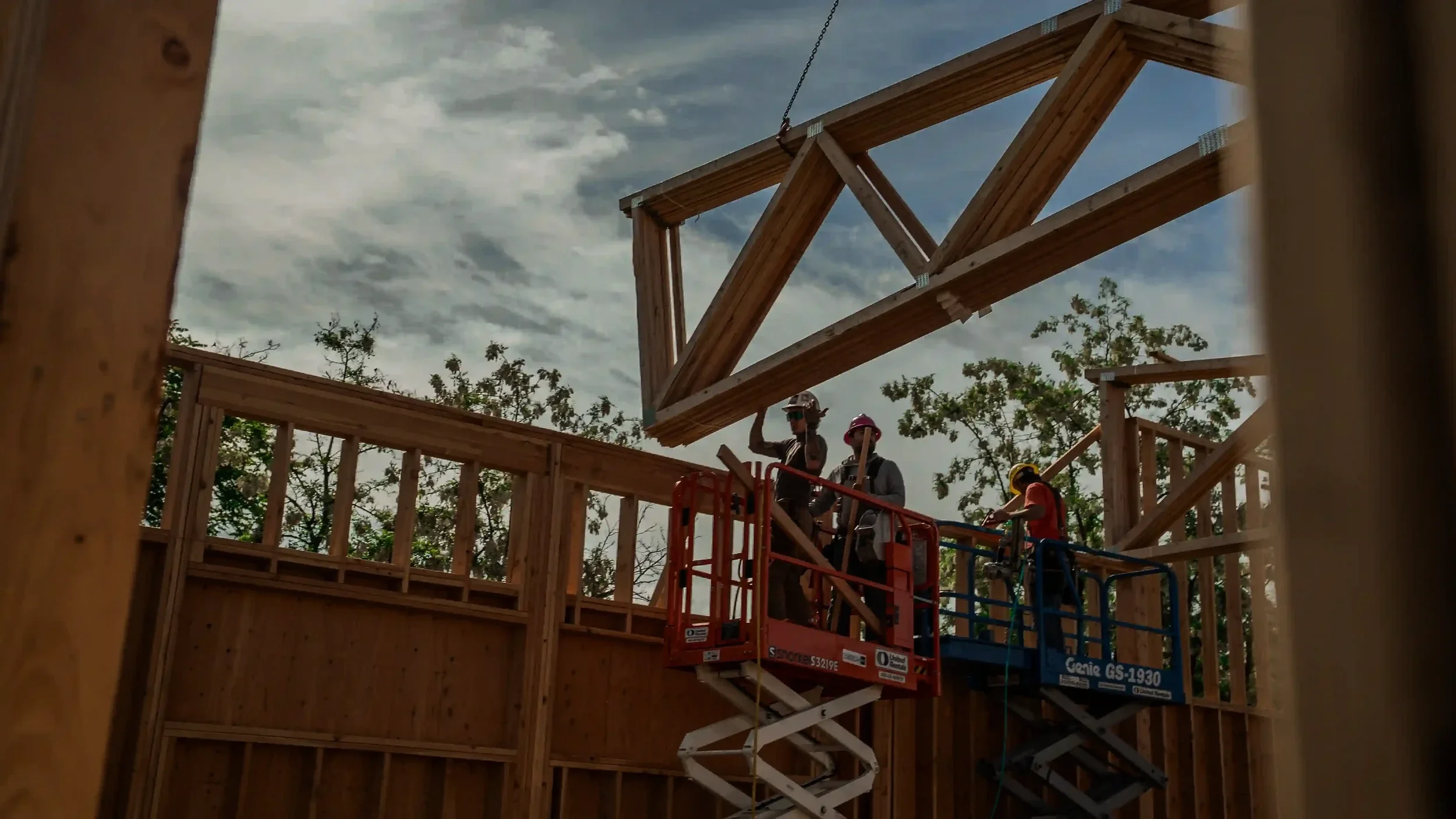 Jepsen Construction crew installing roof trusses during a residential framing project
