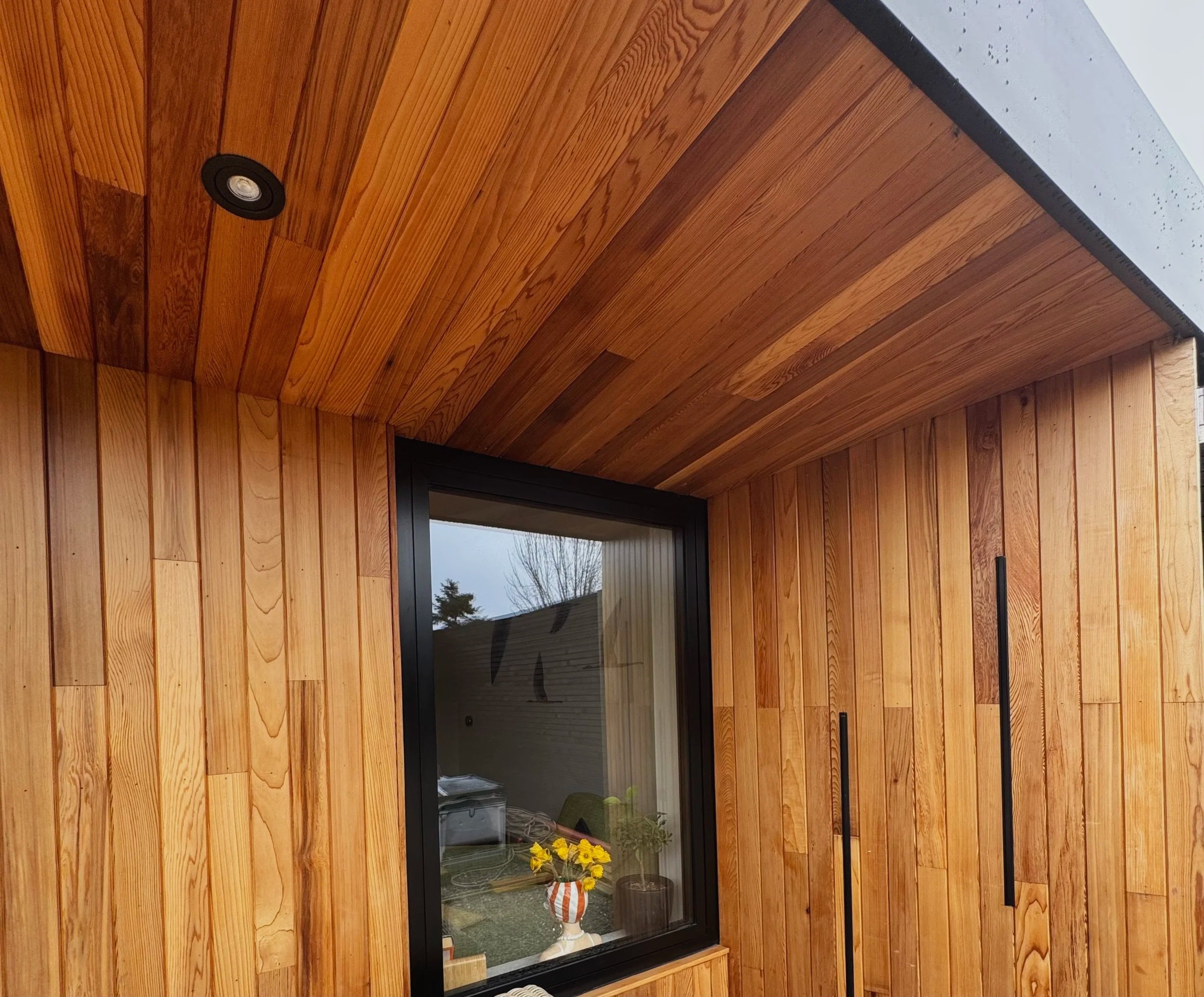 This property extension features a carefully considered architectural envelope detail using Canadian cedar cladding and black aluminum window.