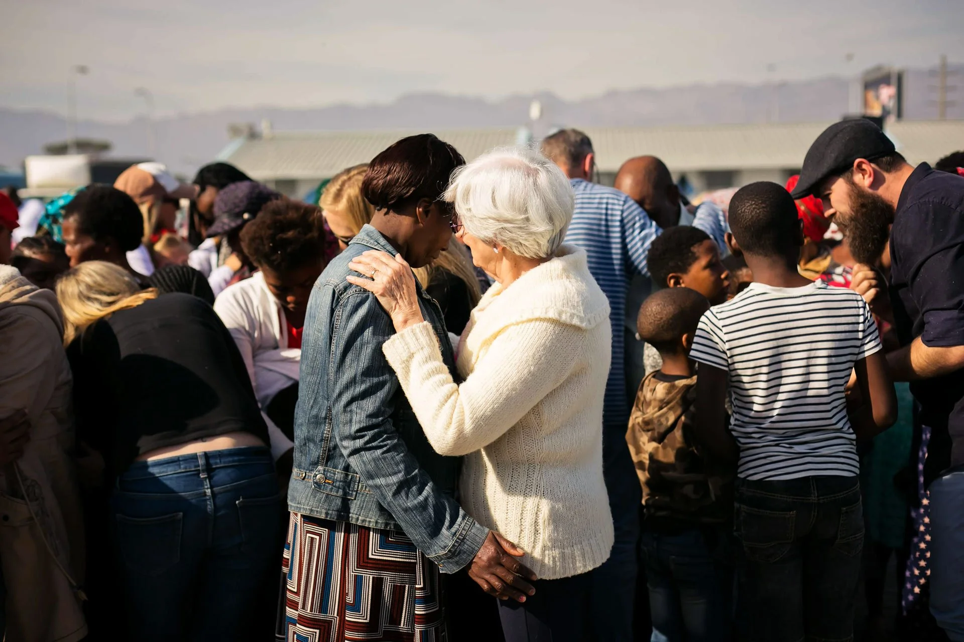 Two women praying at church service