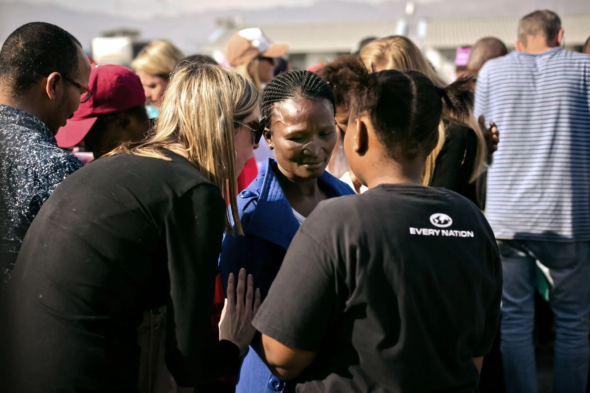 Three women talking at church service