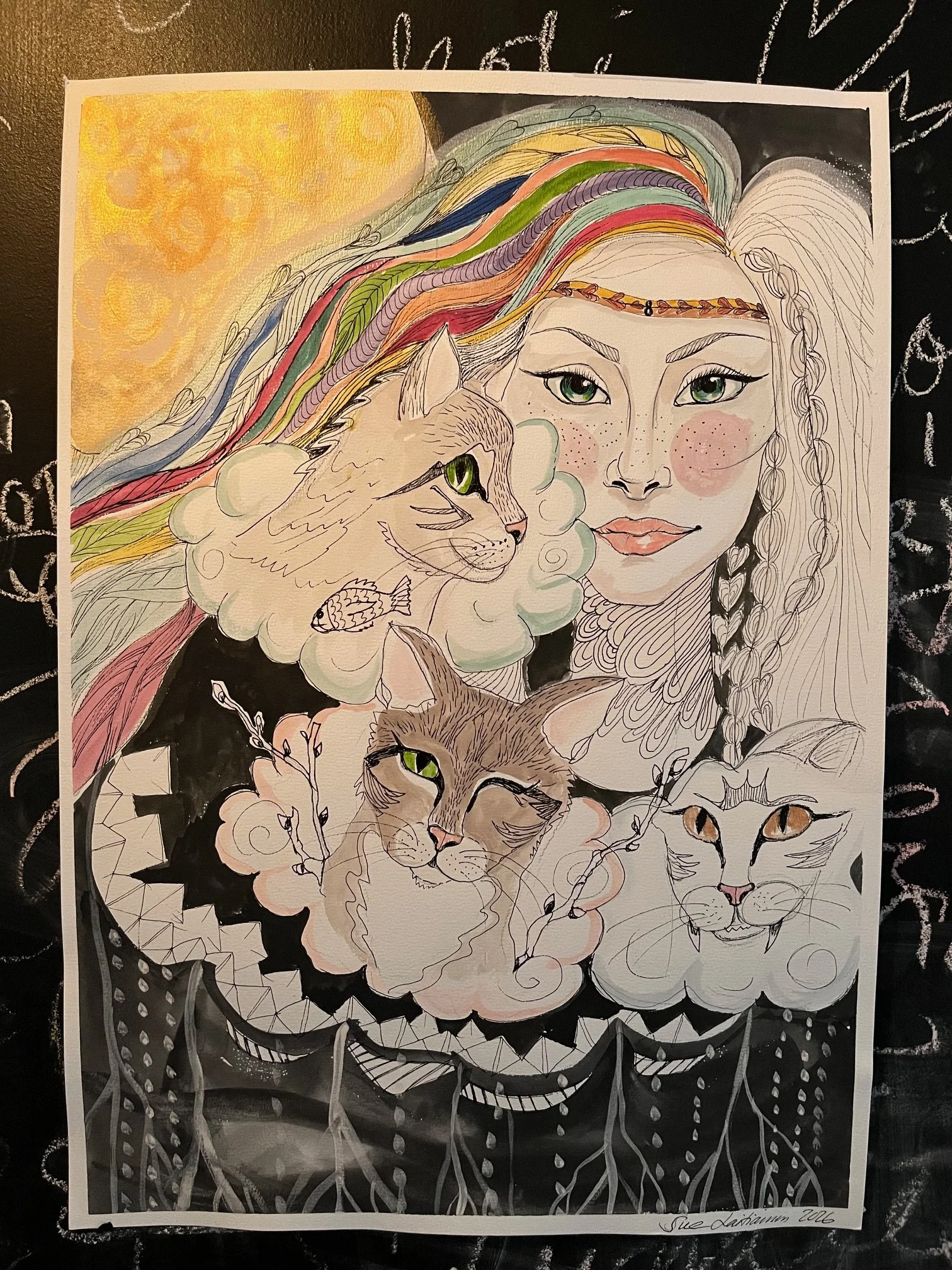 A colorful illustration of a woman with long, flowing rainbow-colored hair surrounded by three cats and a lion. The woman has green eyes, pink cheeks, and a gentle expression. The background features a yellow sun and decorative black and white patter